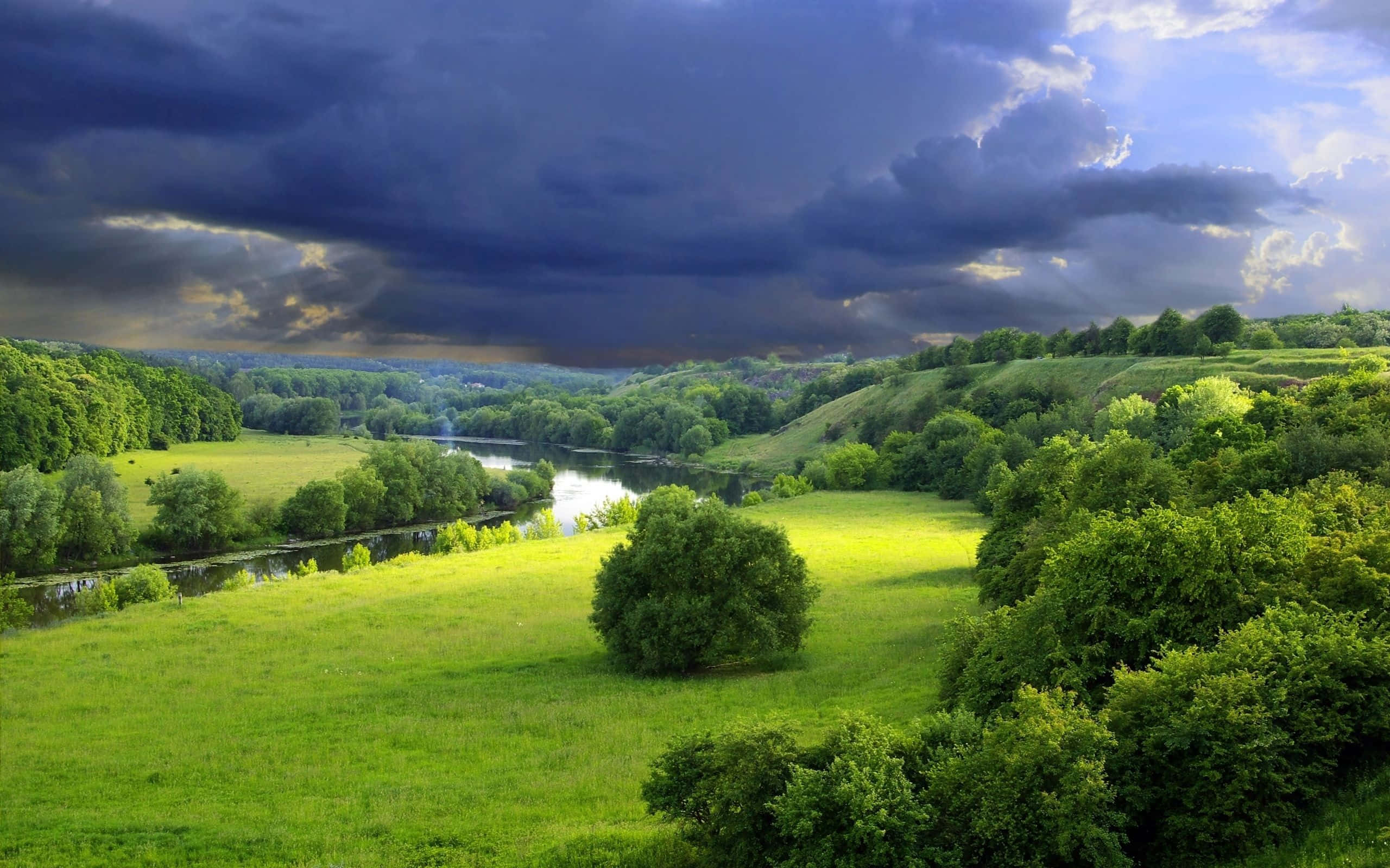 Spring River, winding river, vibrant green hills, 2K Desktop Wallpaper