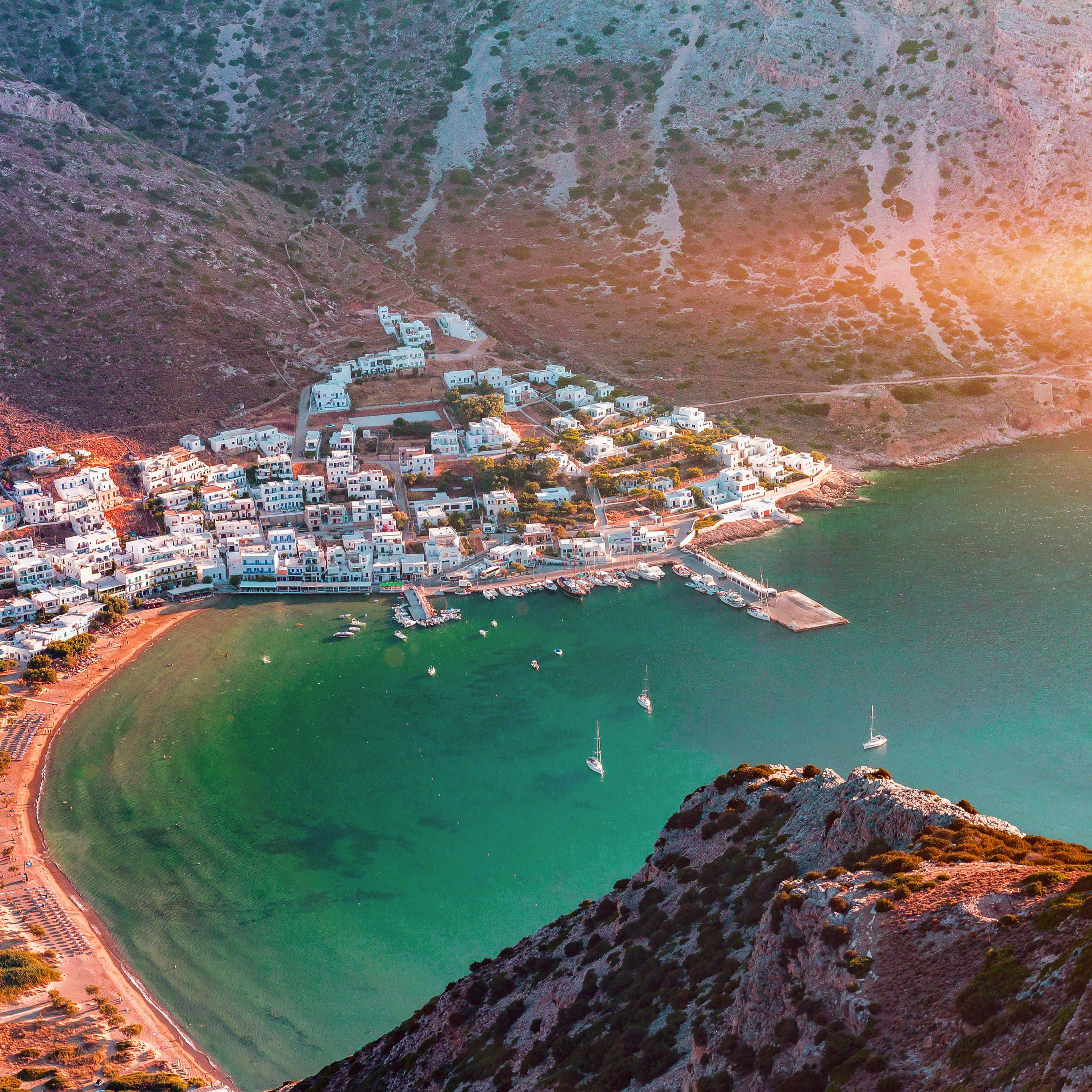 Greek coastal village, turquoise bay, sailboats, 2K Desktop Wallpaper
