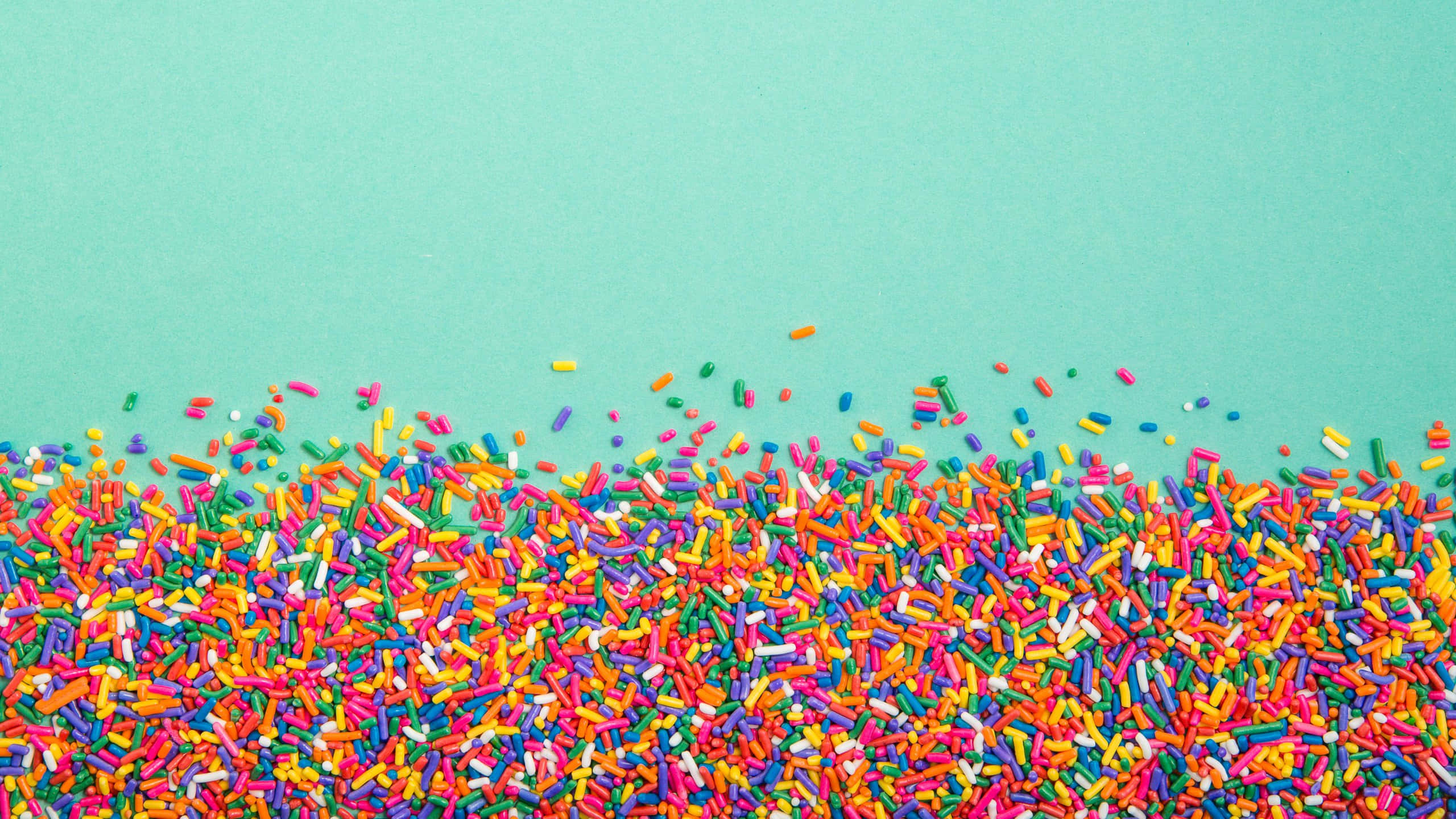 colorful sprinkles, teal background, mint green background, 2K Desktop Wallpaper