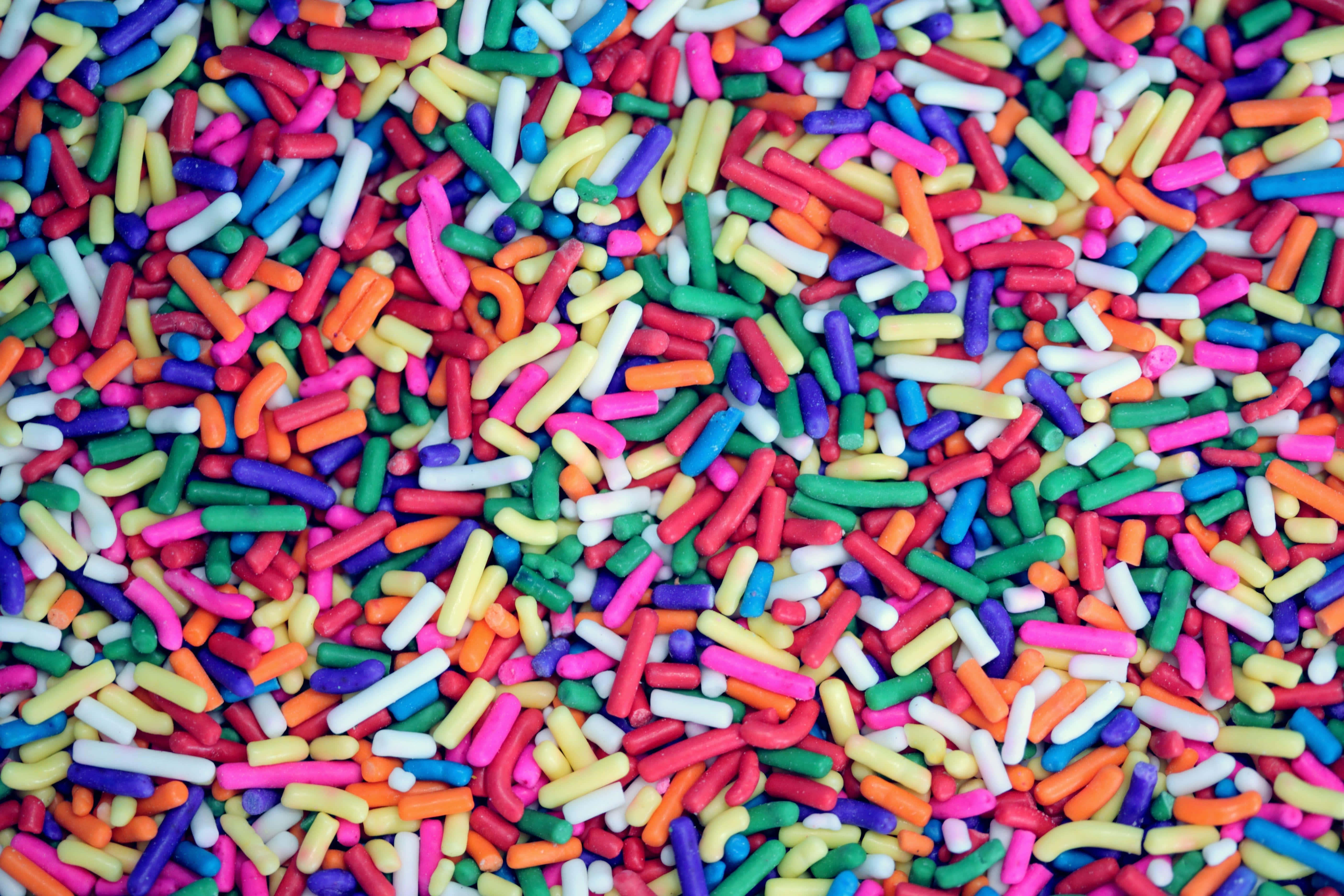 colorful sprinkles, multicolored cylindrical sprinkles, vibrant close-up, 5K Desktop Wallpaper