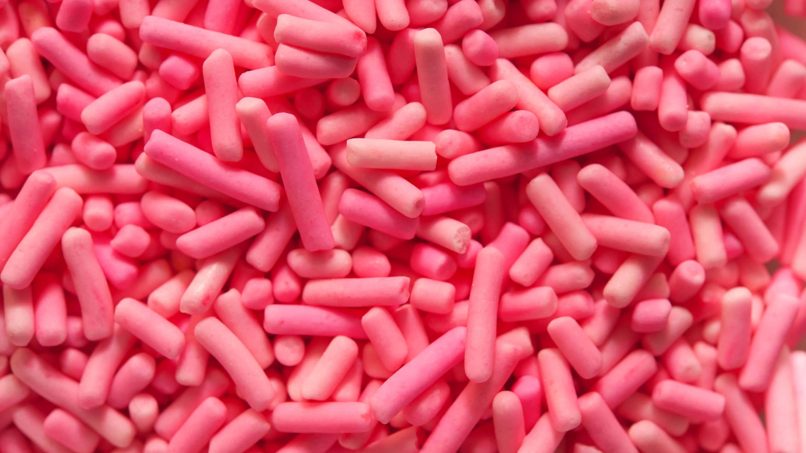 pink sprinkles, vibrant pink, cylindrical sprinkles, 2K Desktop Wallpaper