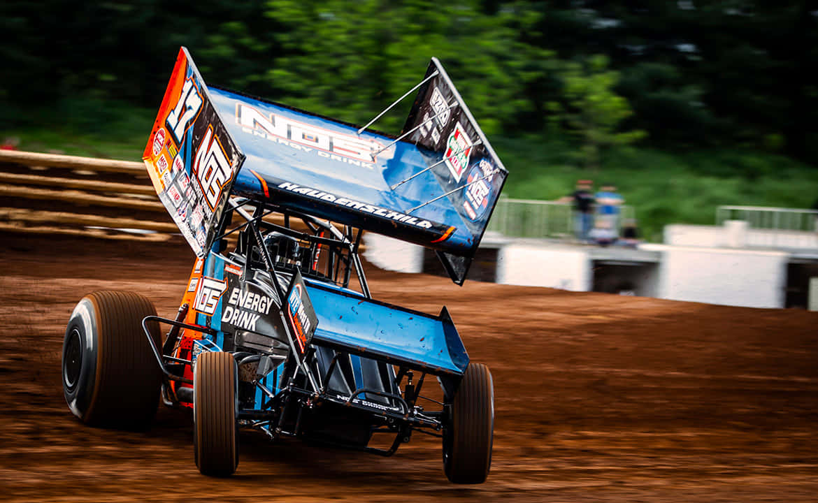 sprint car racing, blue and orange dirt track race car, large wing, SD Desktop Wallpaper