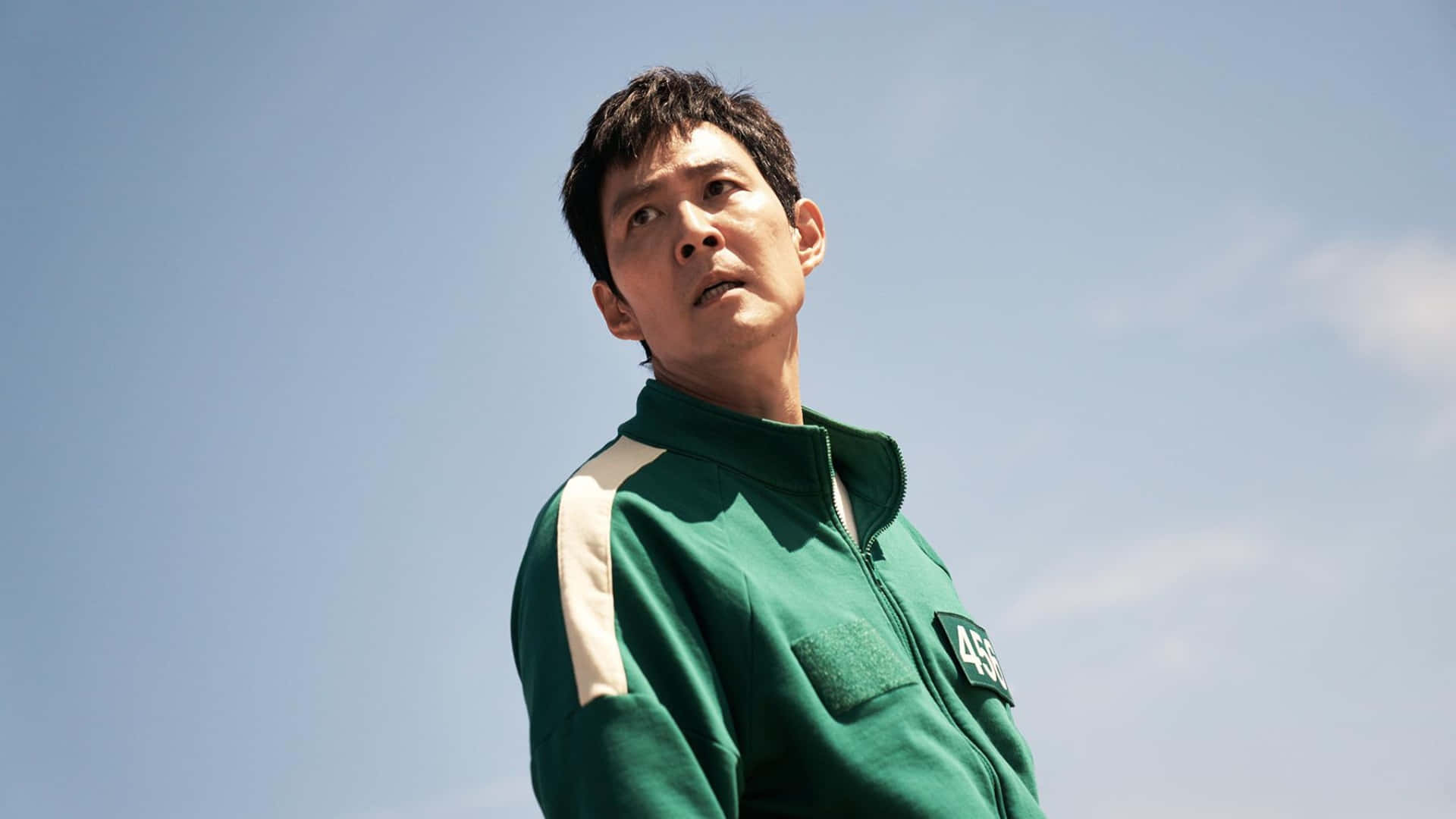 Squid Game Season 2, green and white numbered tracksuit, clear blue sky, Full HD Desktop Wallpaper