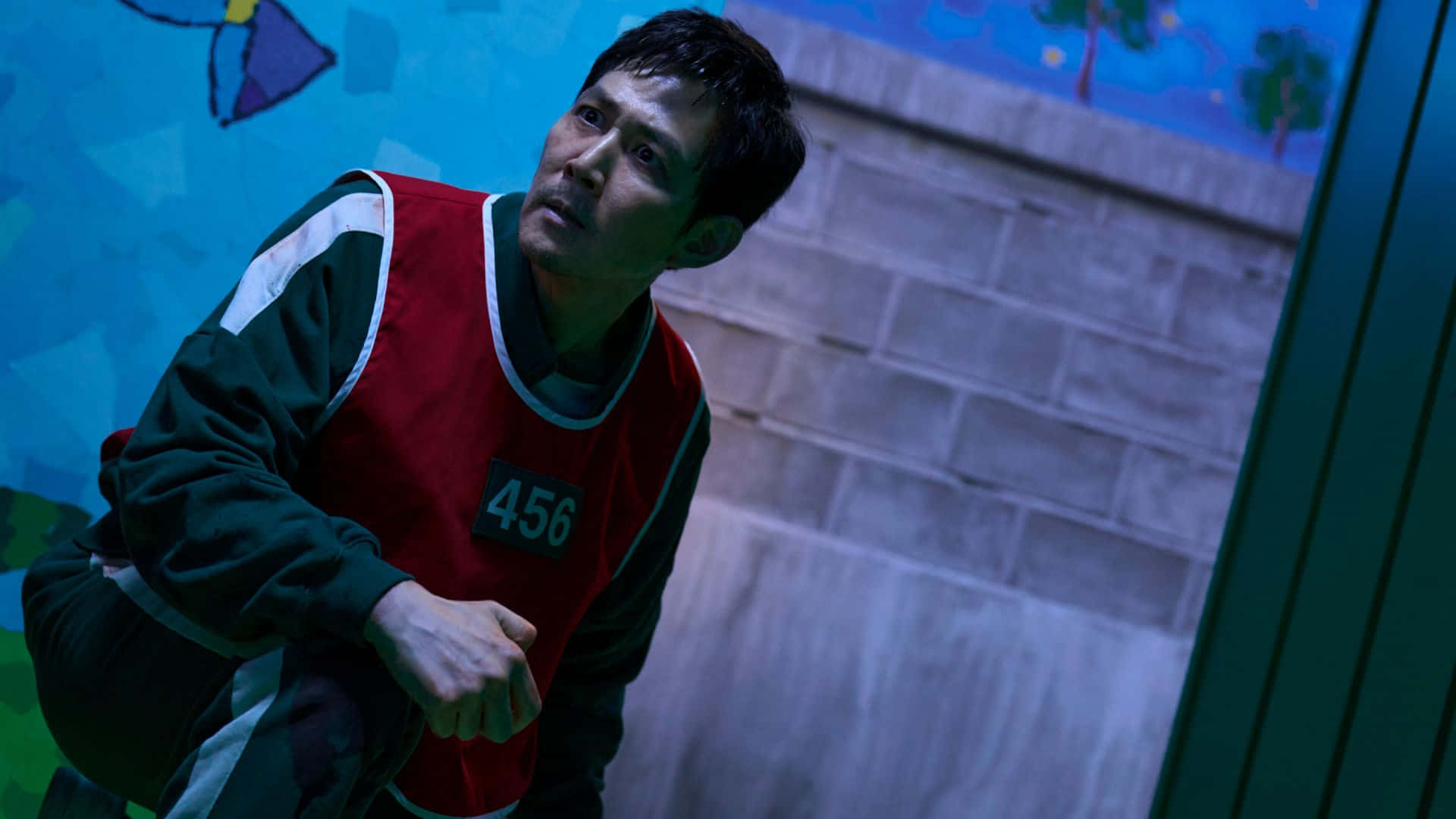 Squid Game Season 3, red numbered vest, brick wall, Full HD Desktop Wallpaper