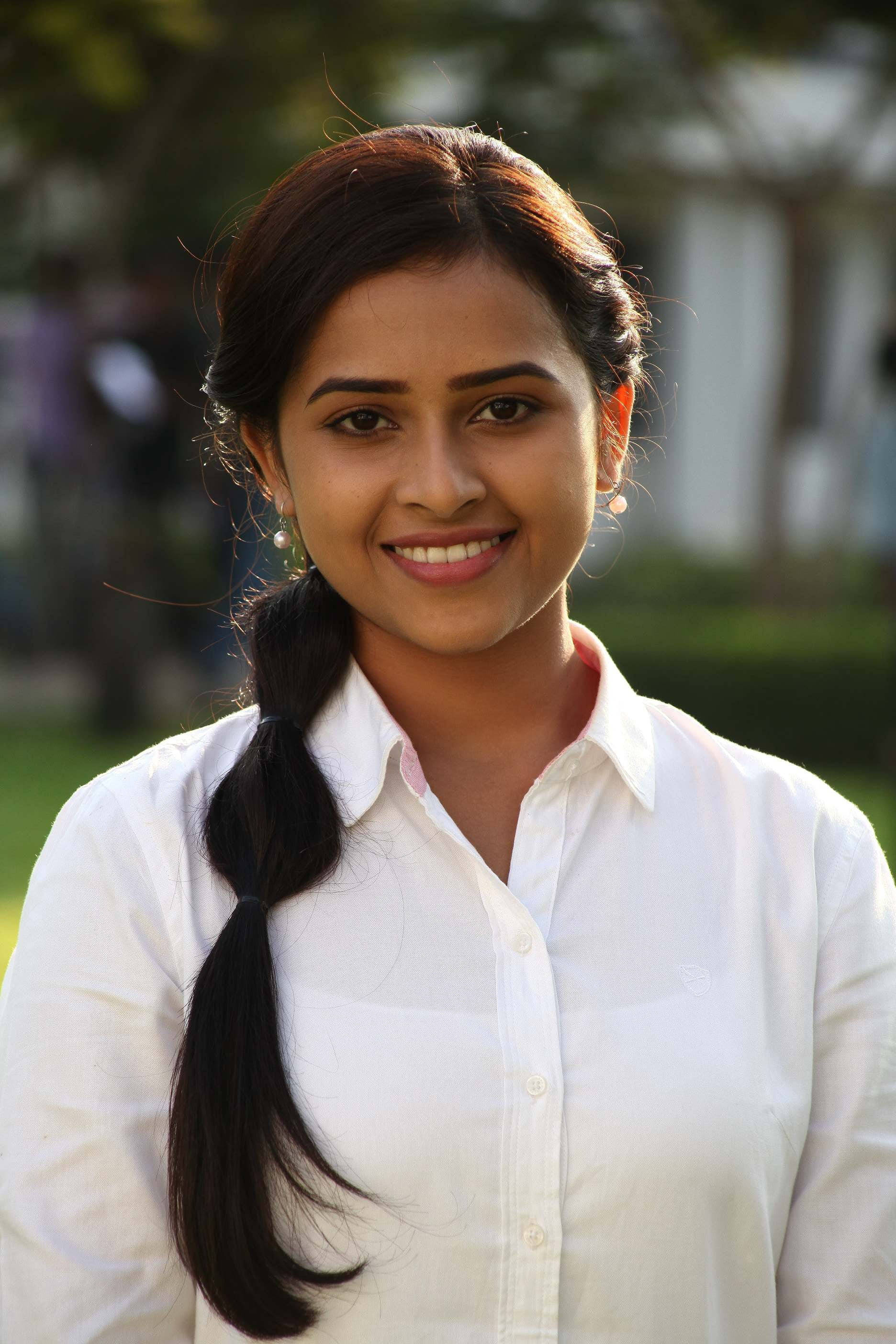Sri Divya, white long-sleeved shirt, dark braided hair, 2K Phone Wallpaper