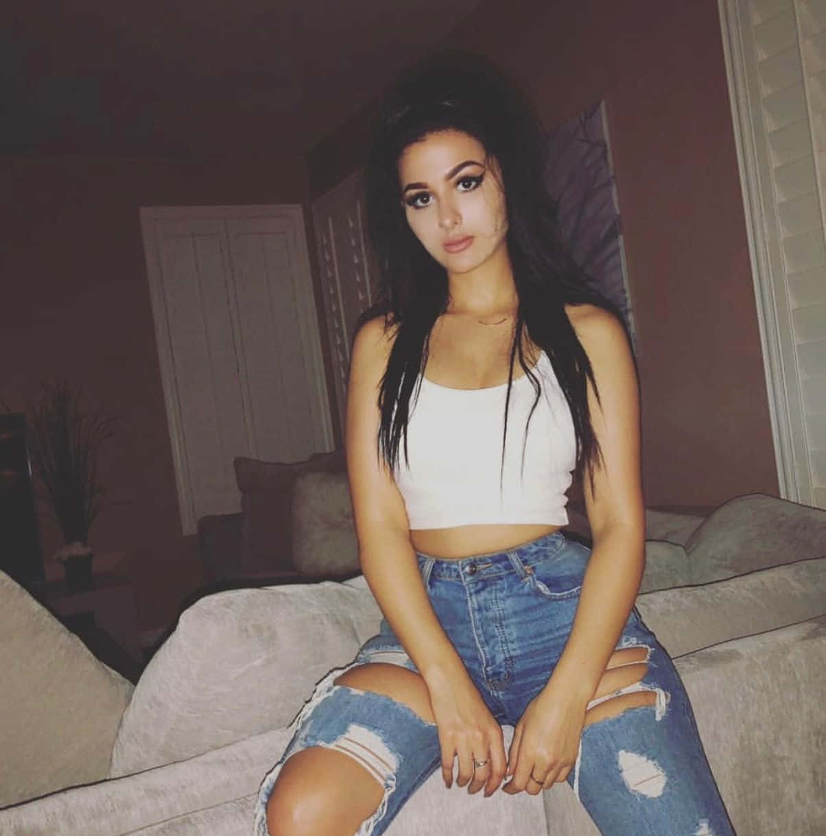 Sssniperwolf, beige couch, white crop top, SD Phone Wallpaper