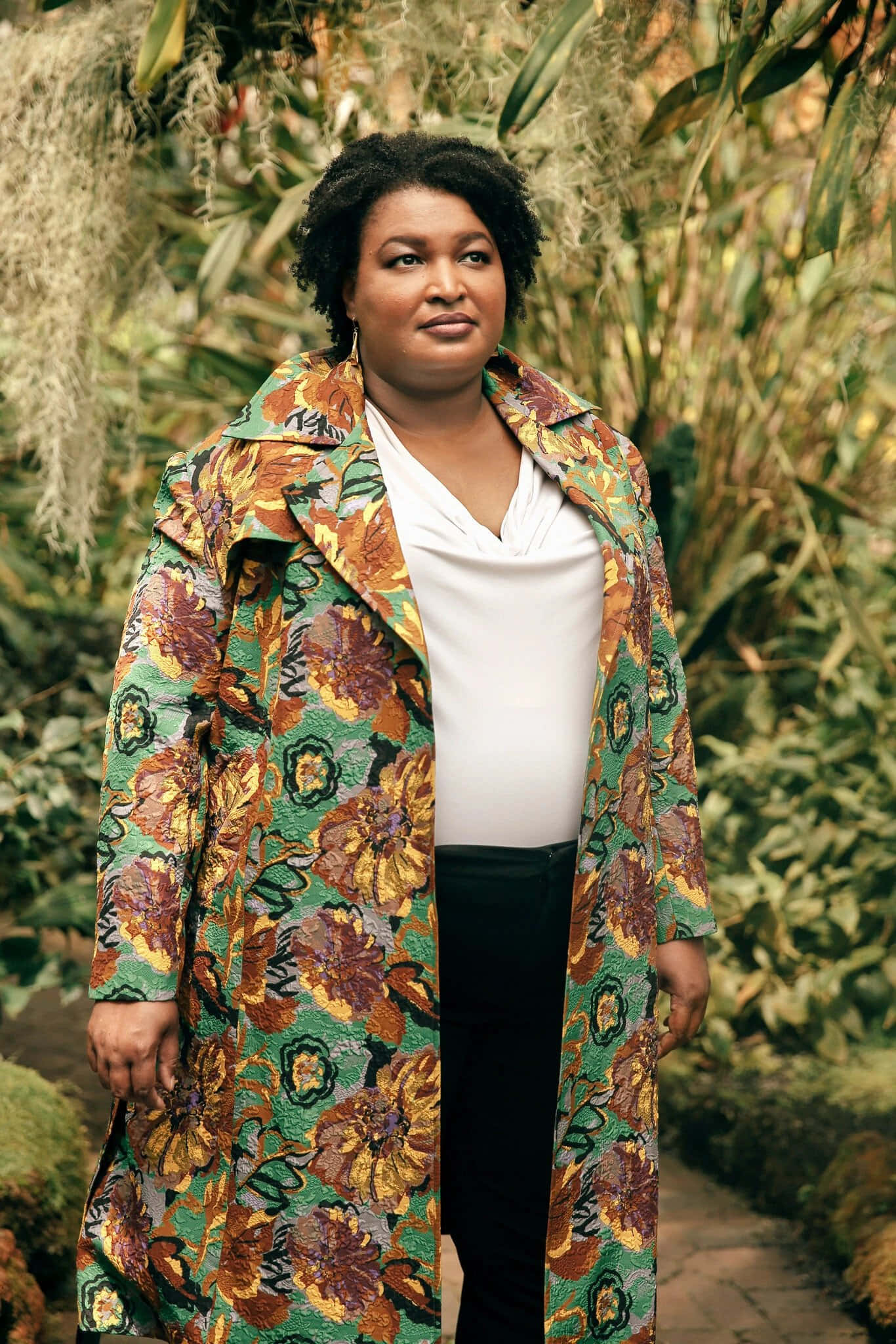 Stacey Abrams, floral coat, lush green foliage, Full HD Phone Wallpaper