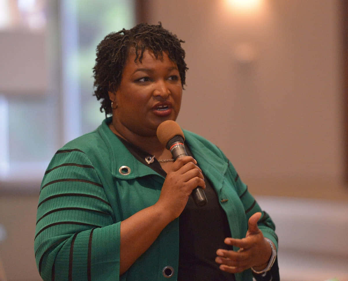 Stacey Abrams, mic, indoor setting, SD Desktop Wallpaper