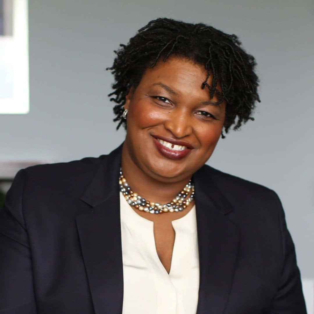 Stacey Abrams, short dreadlocks, dark blazer, SD Desktop Wallpaper