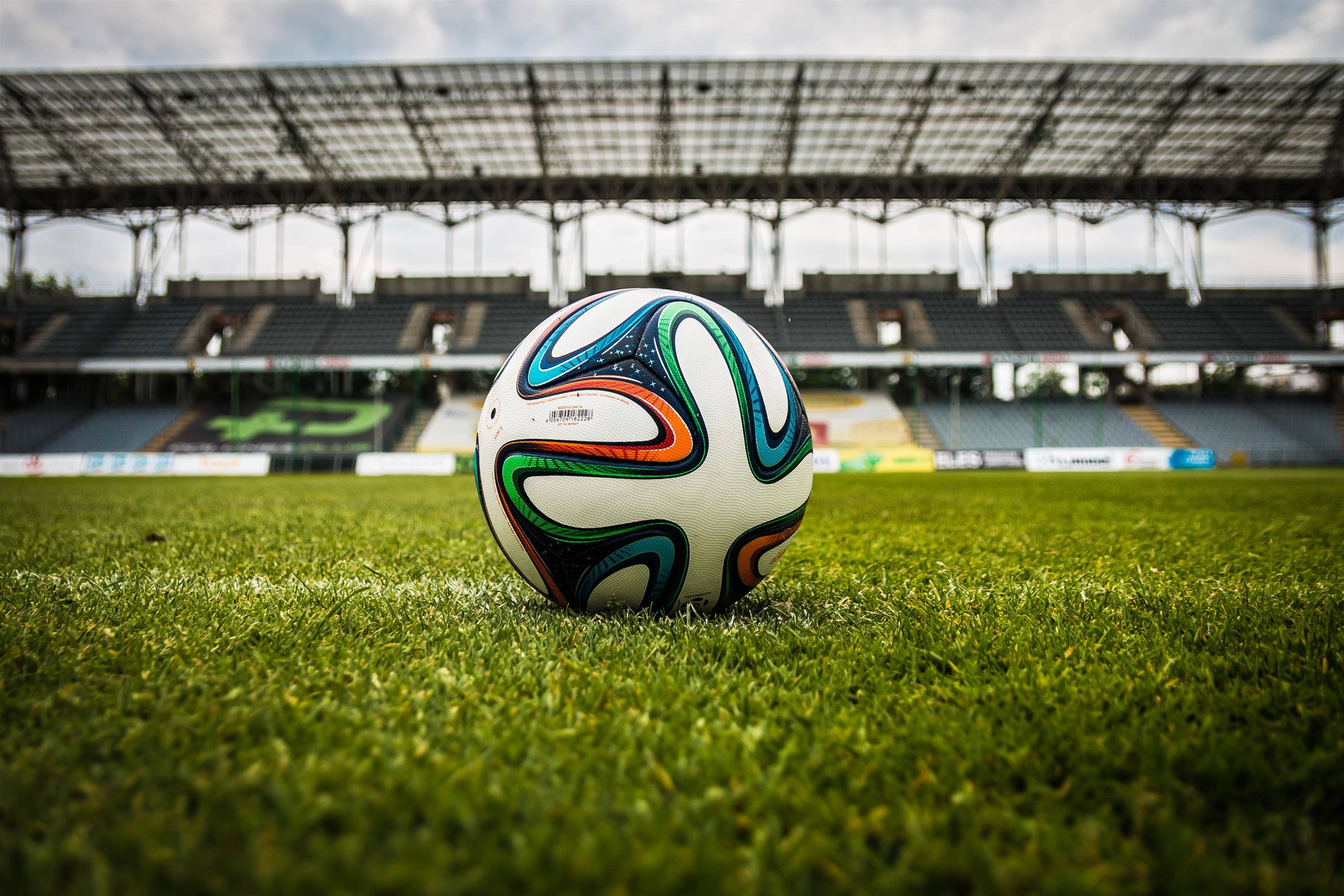 football stadium, soccer ball, lush green grass, 2K Desktop Wallpaper