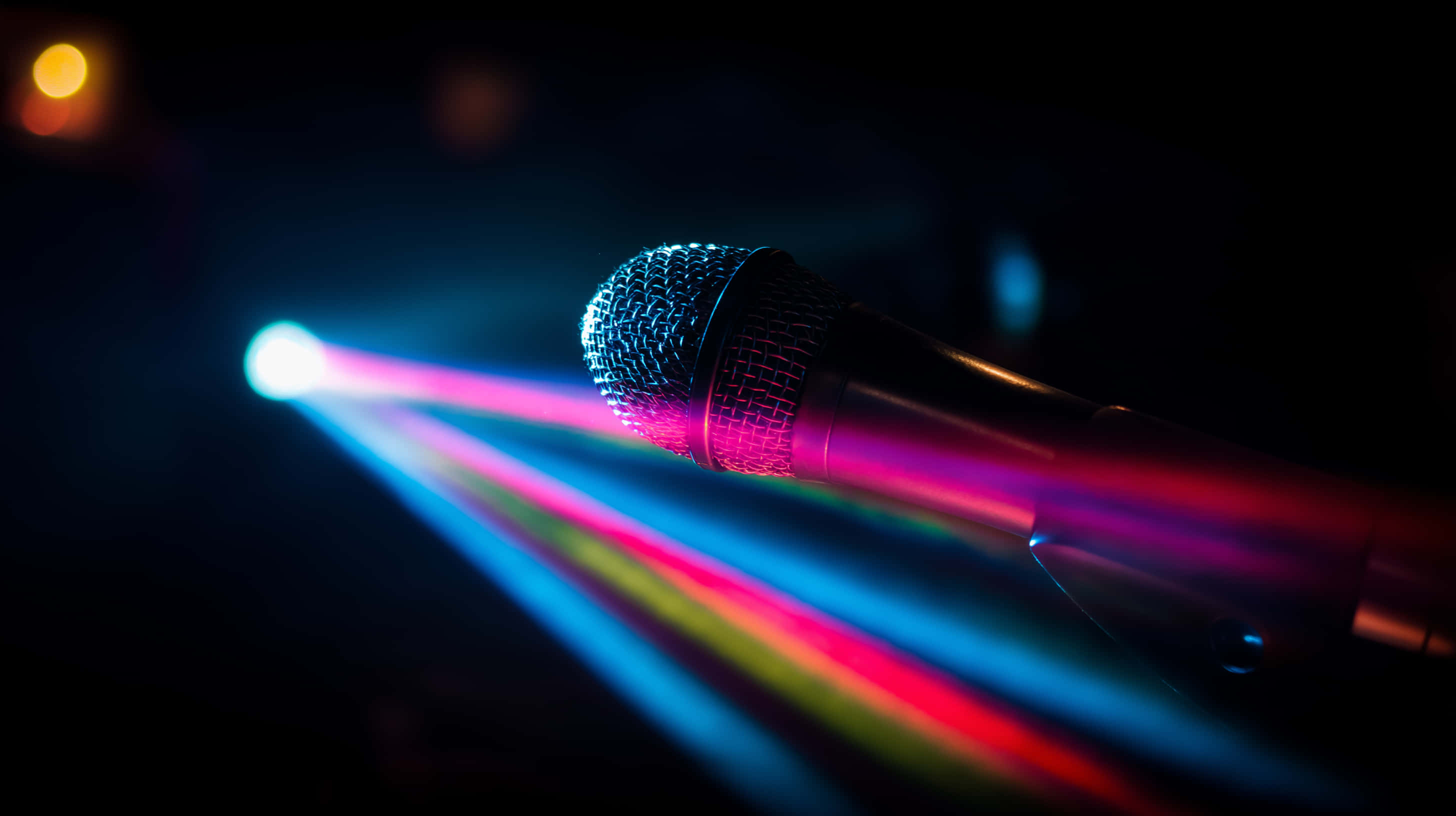 stage microphone, neon light beams, dark stage backdrop, 2K Desktop Wallpaper
