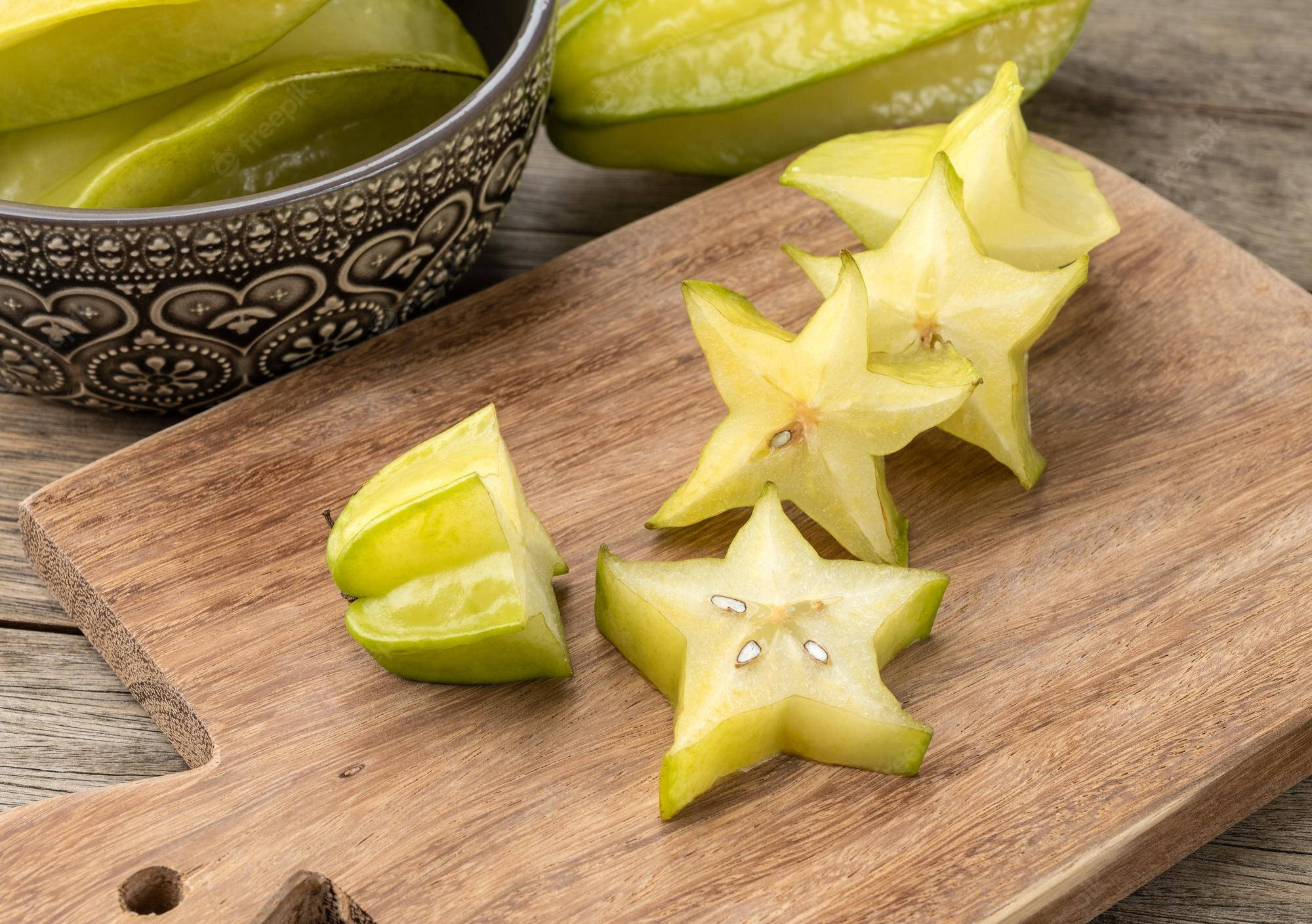 star fruit, wooden cutting board, patterned bowl, Full HD Desktop Wallpaper