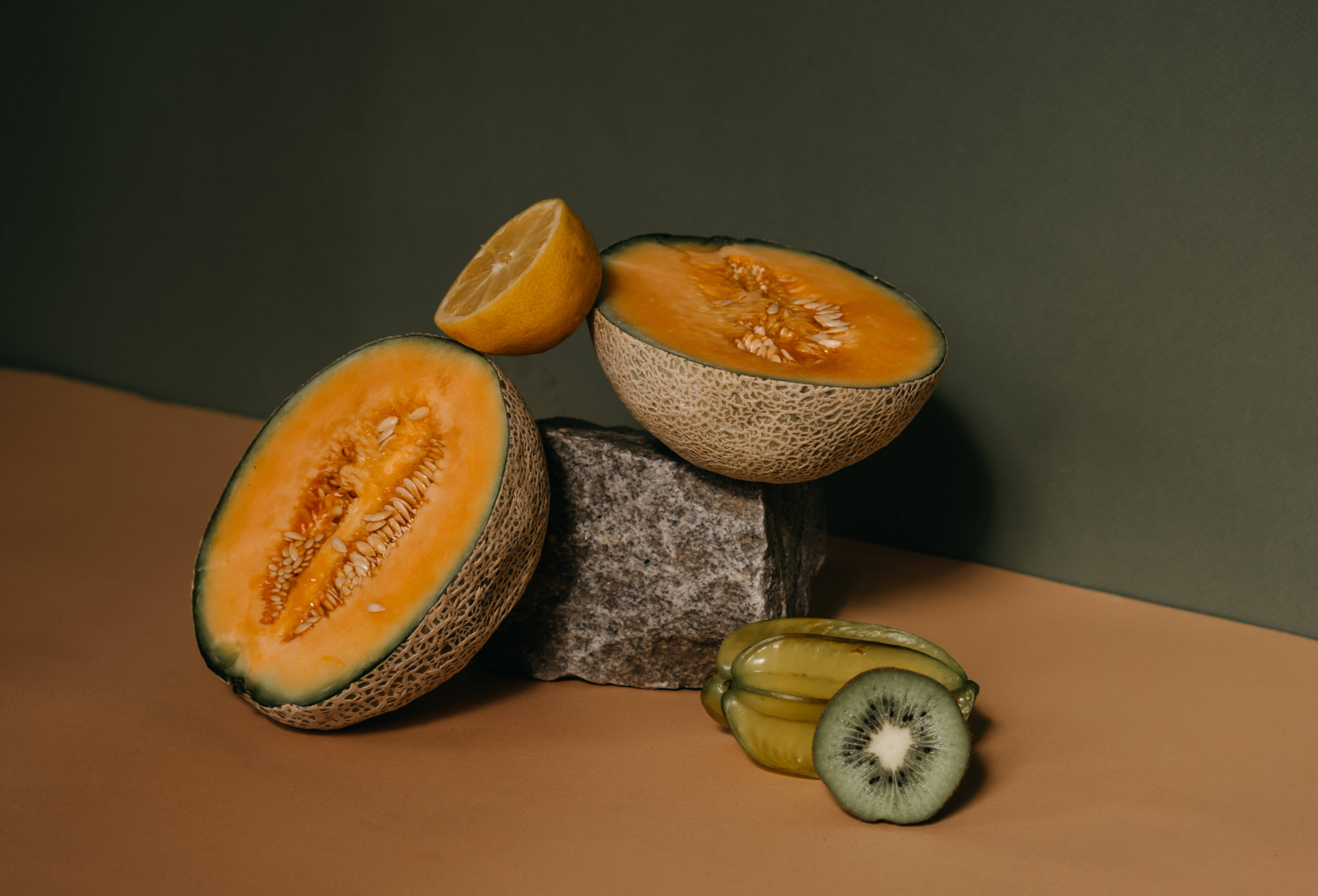 Star Fruit, stone block, muted green wall, 4K Desktop Wallpaper