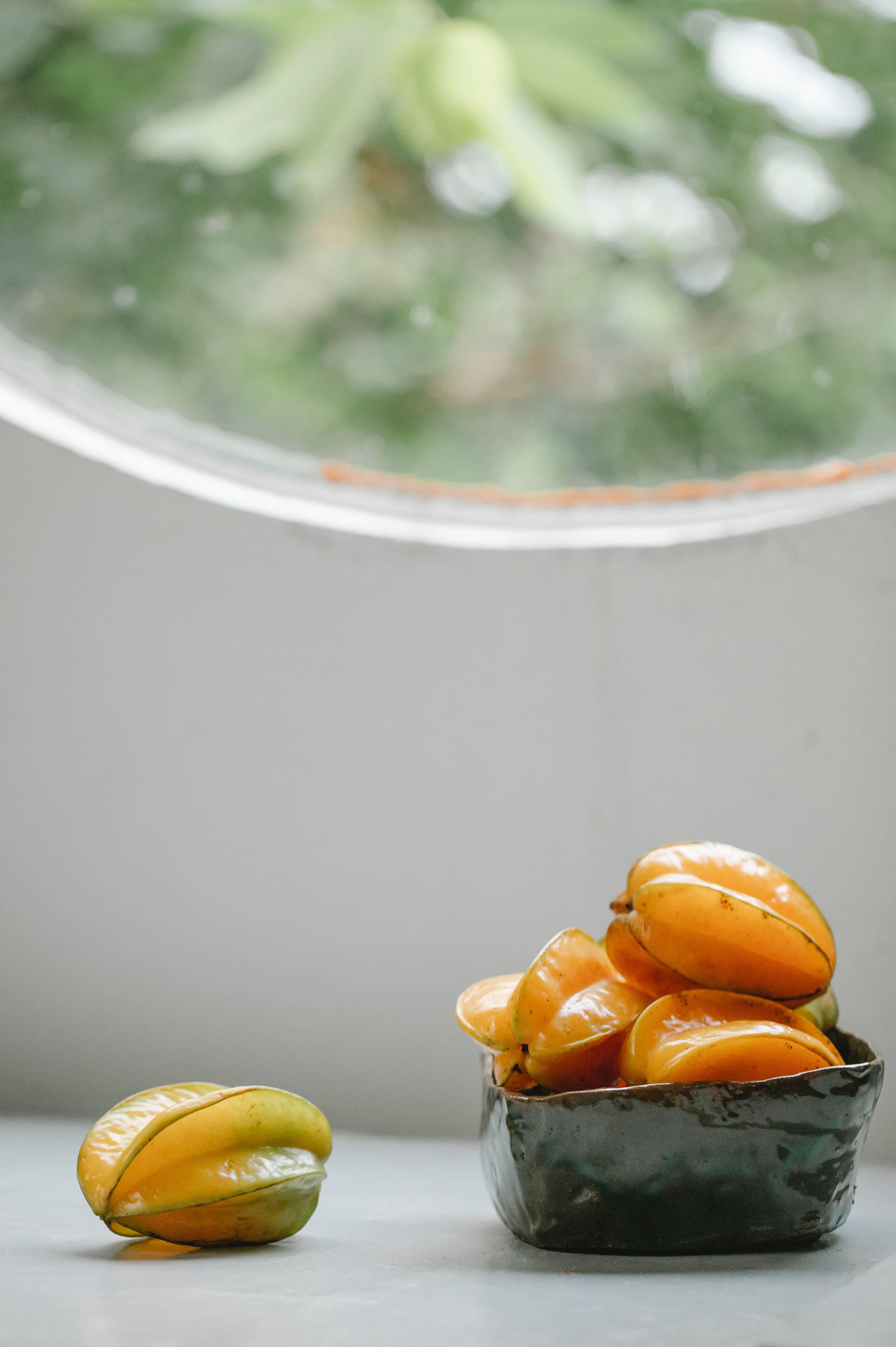 Star Fruit, white table, gray surface, 4K Phone Wallpaper