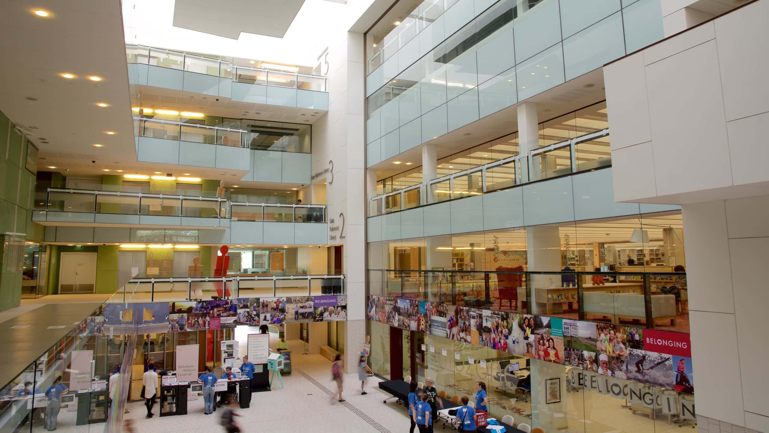modern state library interior, multi-level atrium, glass railings, 2K Desktop Wallpaper