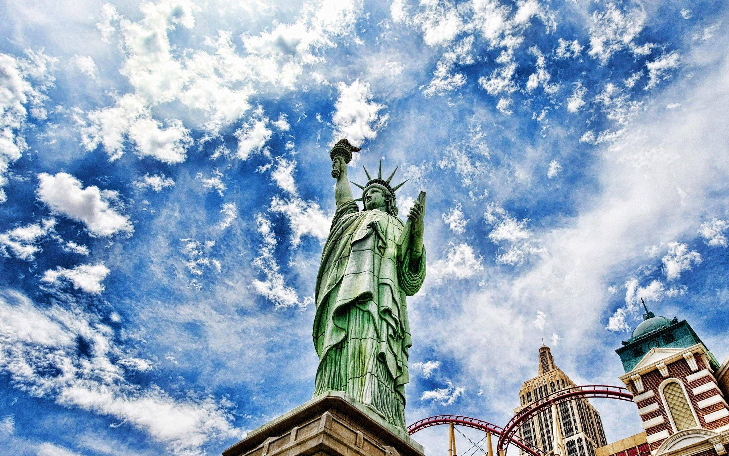 Statue of Liberty, twilight, vibrant blue sky, 2K Desktop Wallpaper