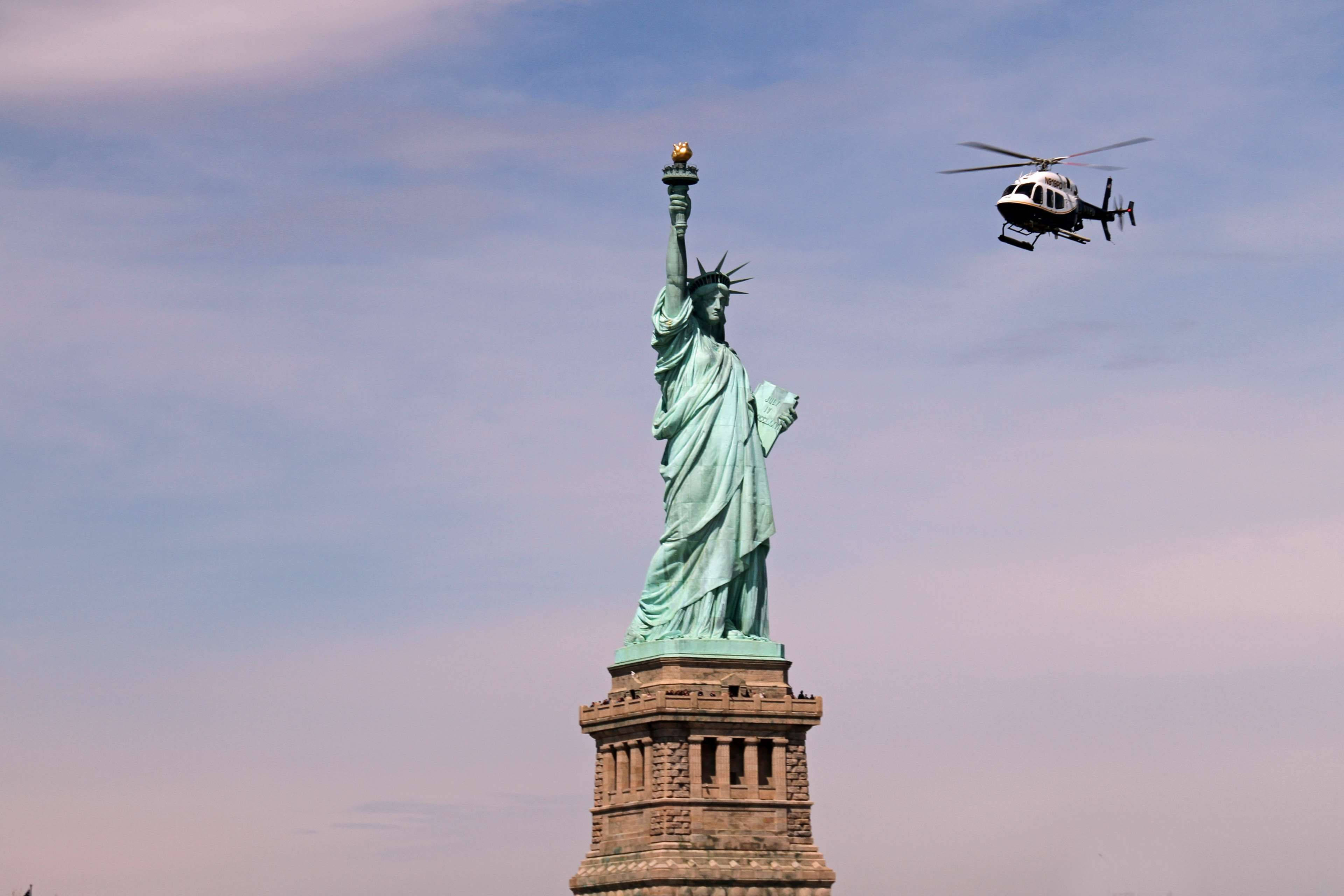 Statue Of Liberty, helicopter, soft blue sky, 4K Desktop Wallpaper