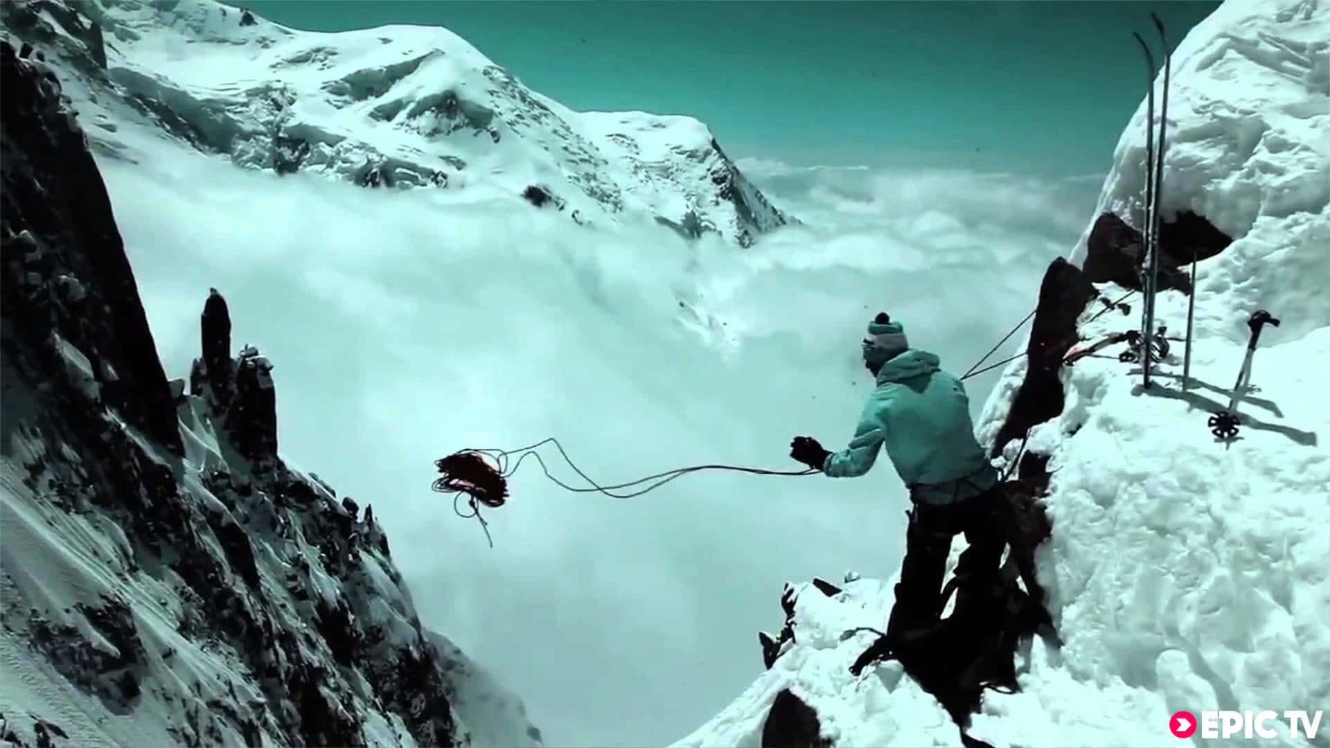 teal jacket, snowy mountain cliff, sea of clouds, Full HD Desktop Wallpaper