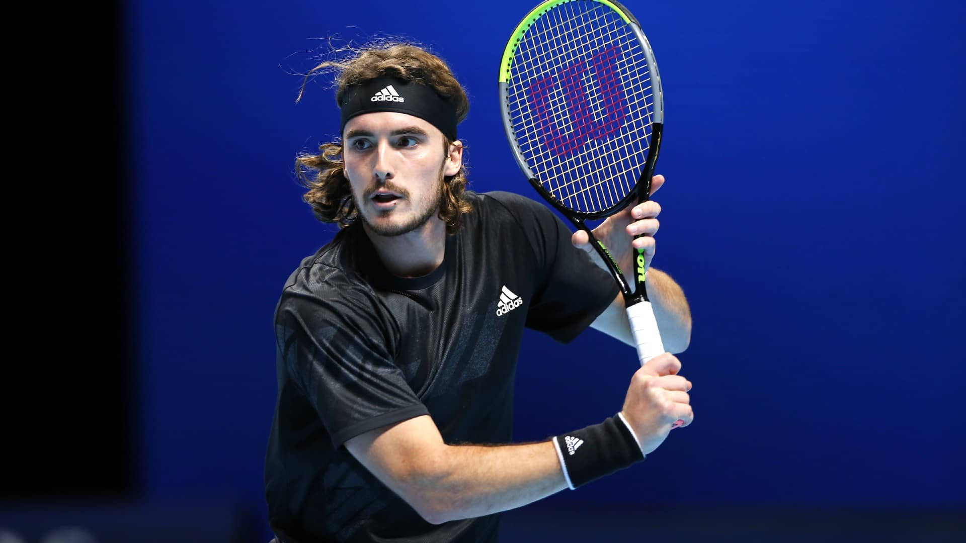 Stefanos Tsitsipas, both hands on racket, long hair, Full HD Desktop Wallpaper