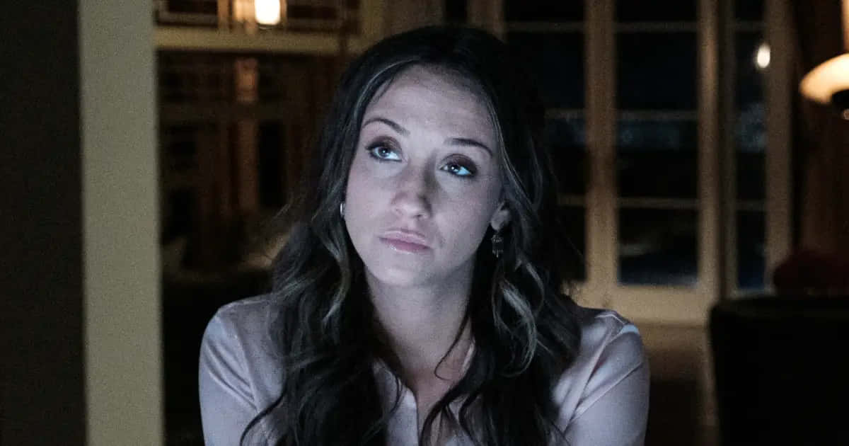 Stella Maeve, dimly lit room, warm ambient lighting, SD Desktop Wallpaper