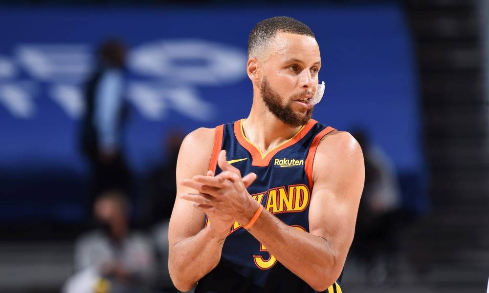 Steph Curry, blue and orange Warriors jersey, white mouthguard, SD Desktop Wallpaper