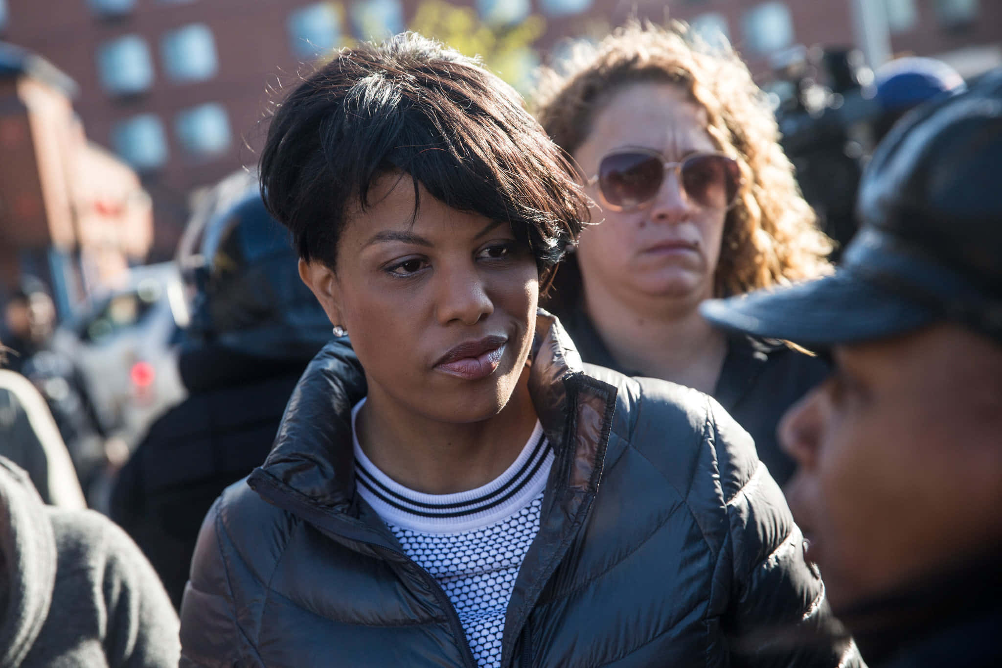 Stephanie Rawlings-Blake, black puffer jacket, crowded urban street scene, Full HD Desktop Wallpaper