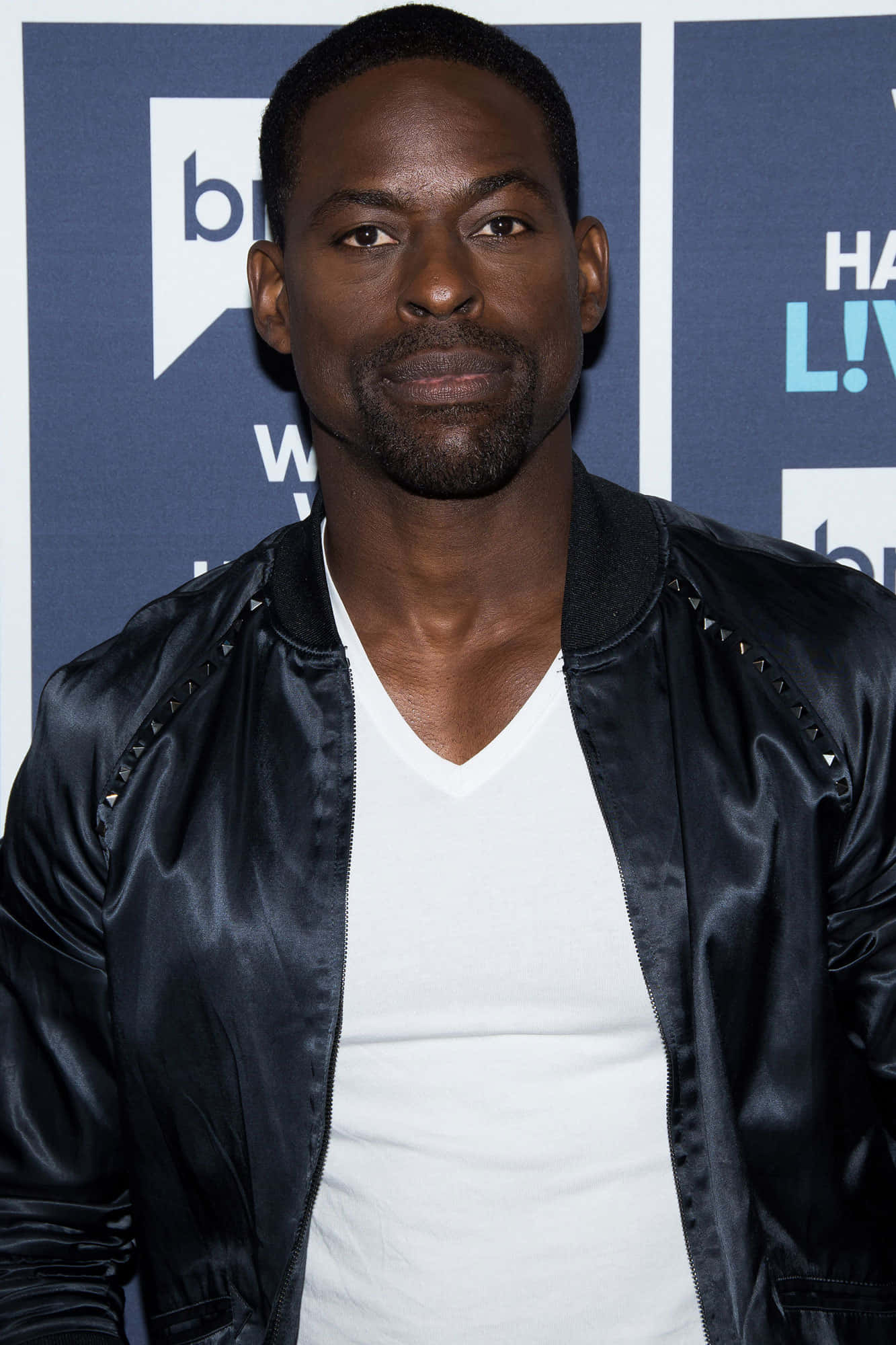 Sterling K Brown, black studded bomber jacket, white v-neck shirt, Full HD Phone Wallpaper
