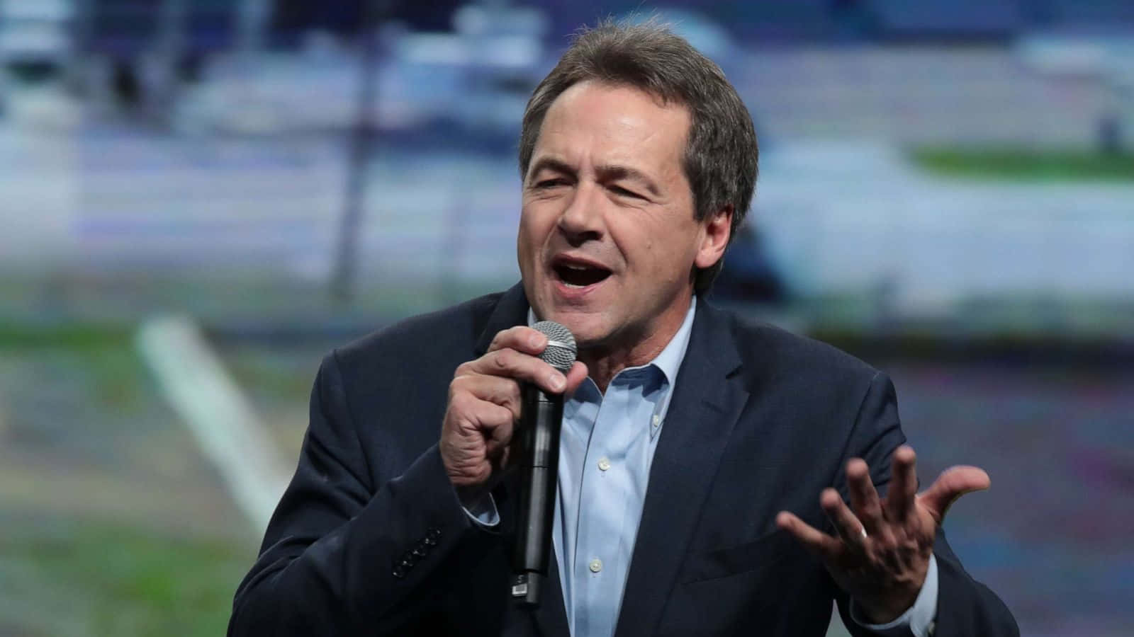 Steve Bullock, dark suit, microphone, HD Desktop Wallpaper