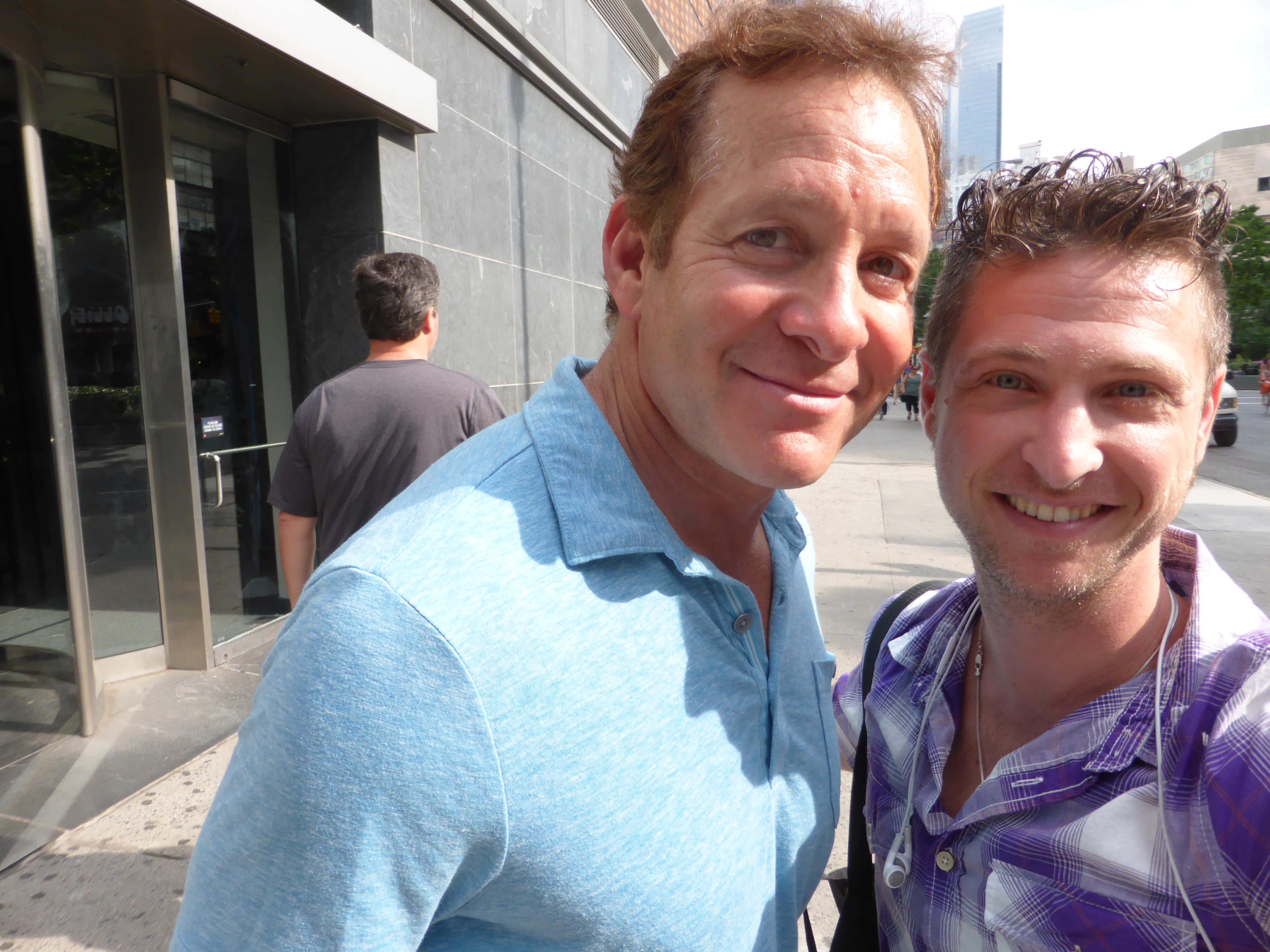 Steve Guttenberg, sunny city sidewalk, modern glass building entrance, 4K Desktop Wallpaper