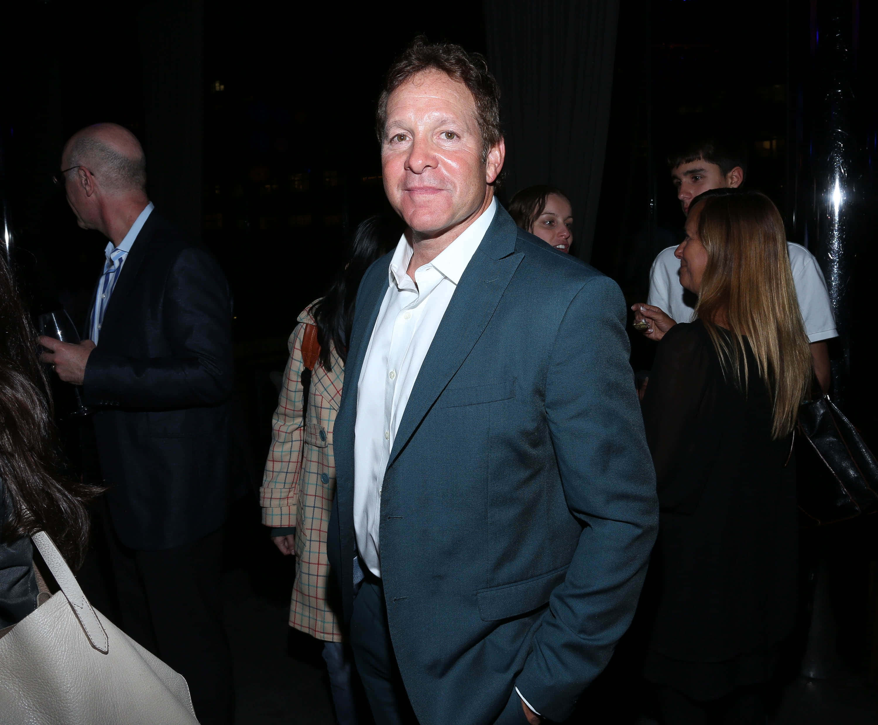 Steve Guttenberg, teal suit, dimly lit social gathering, 2K Desktop Wallpaper