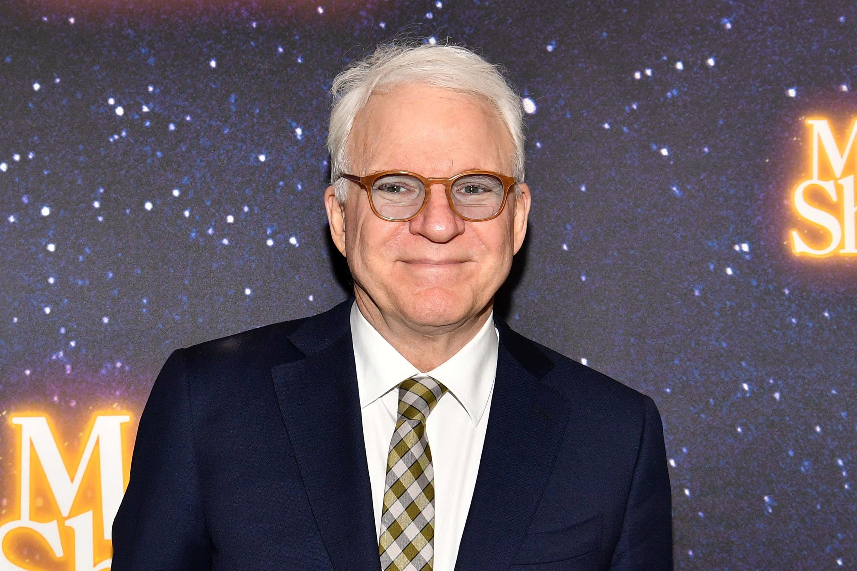 Steve Martin, dark suit, starry backdrop, 2K Desktop Wallpaper