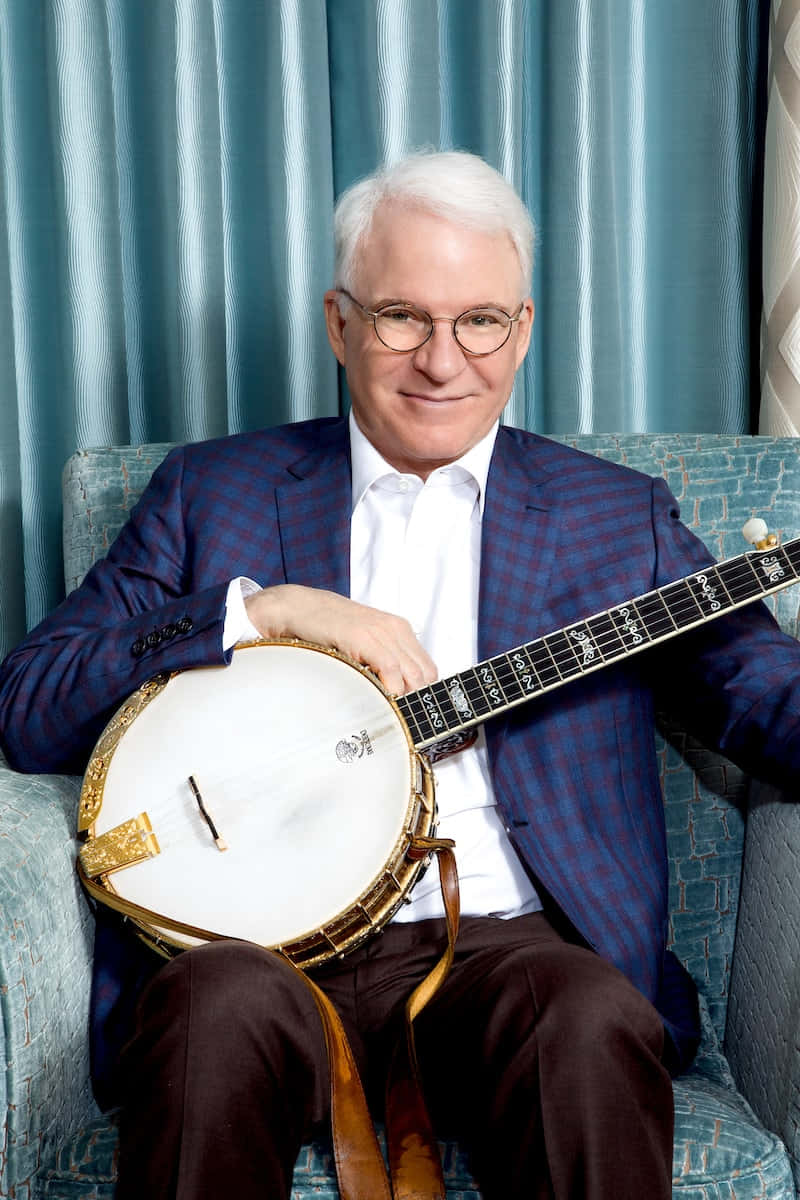 Steve Martin, teal armchair, banjo, SD Phone Wallpaper