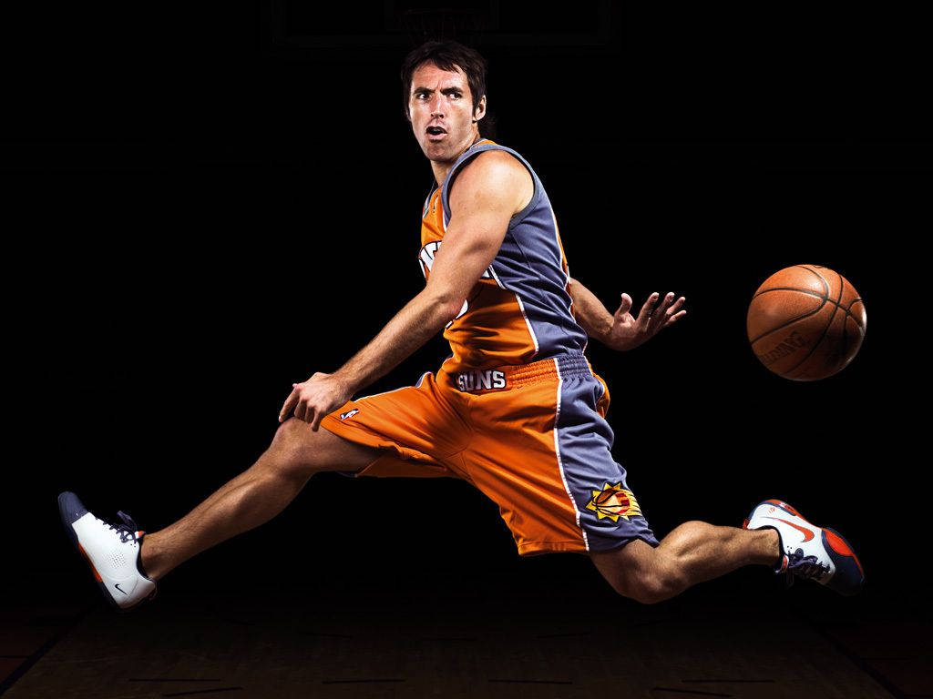 Steve Nash, orange and blue Suns uniform, dribbles low to the ground, SD Desktop Wallpaper