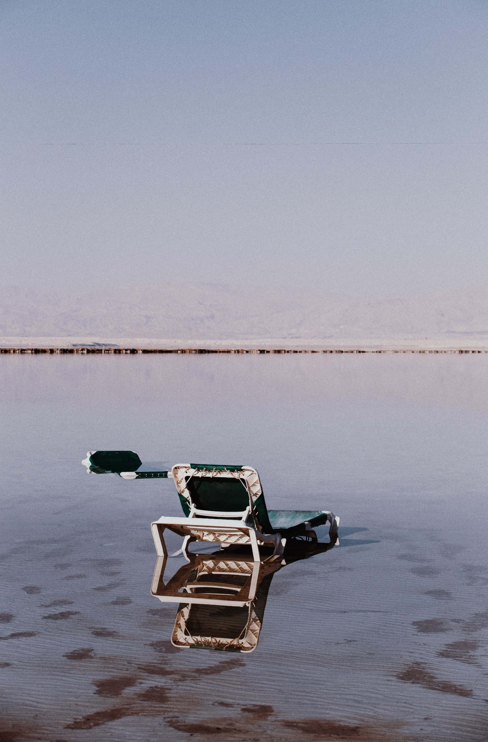 beach lounge chair, still water, distant mountains, Full HD Phone Wallpaper