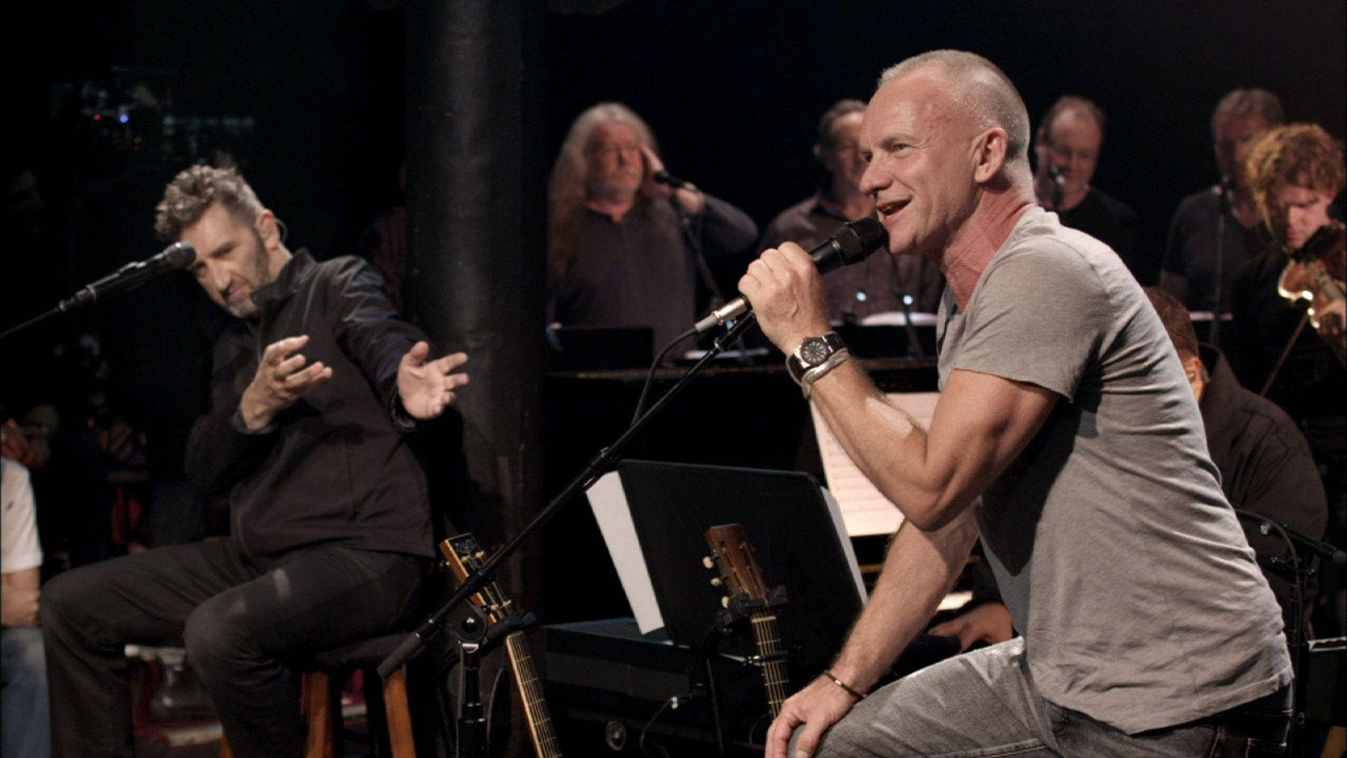 Sting, orchestra, dimly lit stage, Full HD Desktop Wallpaper