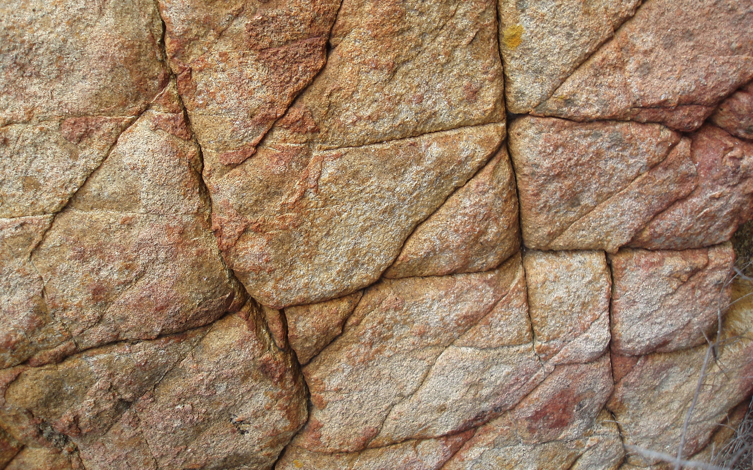 bare brown stone wall, rugged textured rock wall, earthy tones, 2K Desktop Wallpaper