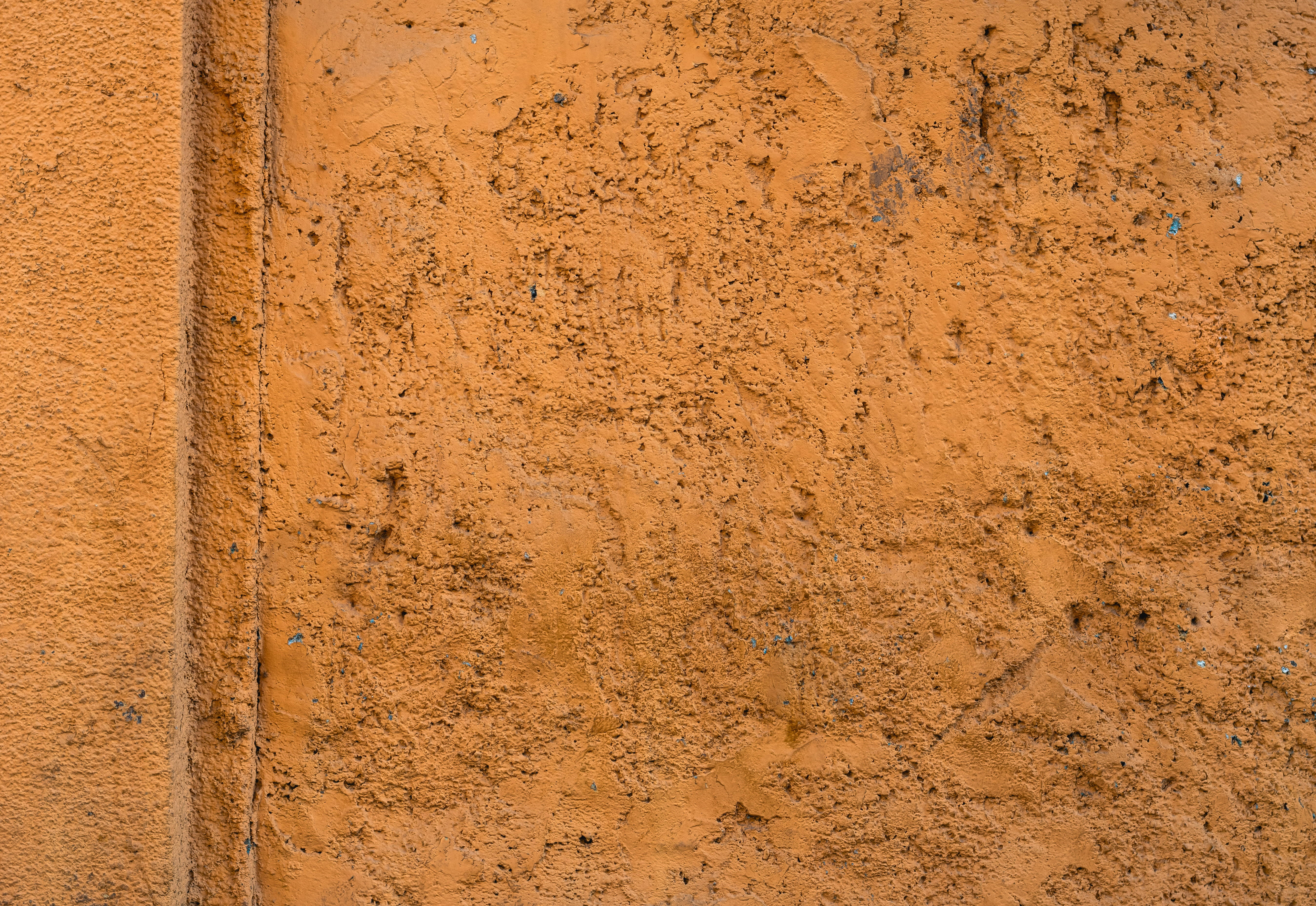 orange stone wall, rough textured orange plaster wall, visible cracks, 5K Desktop Wallpaper