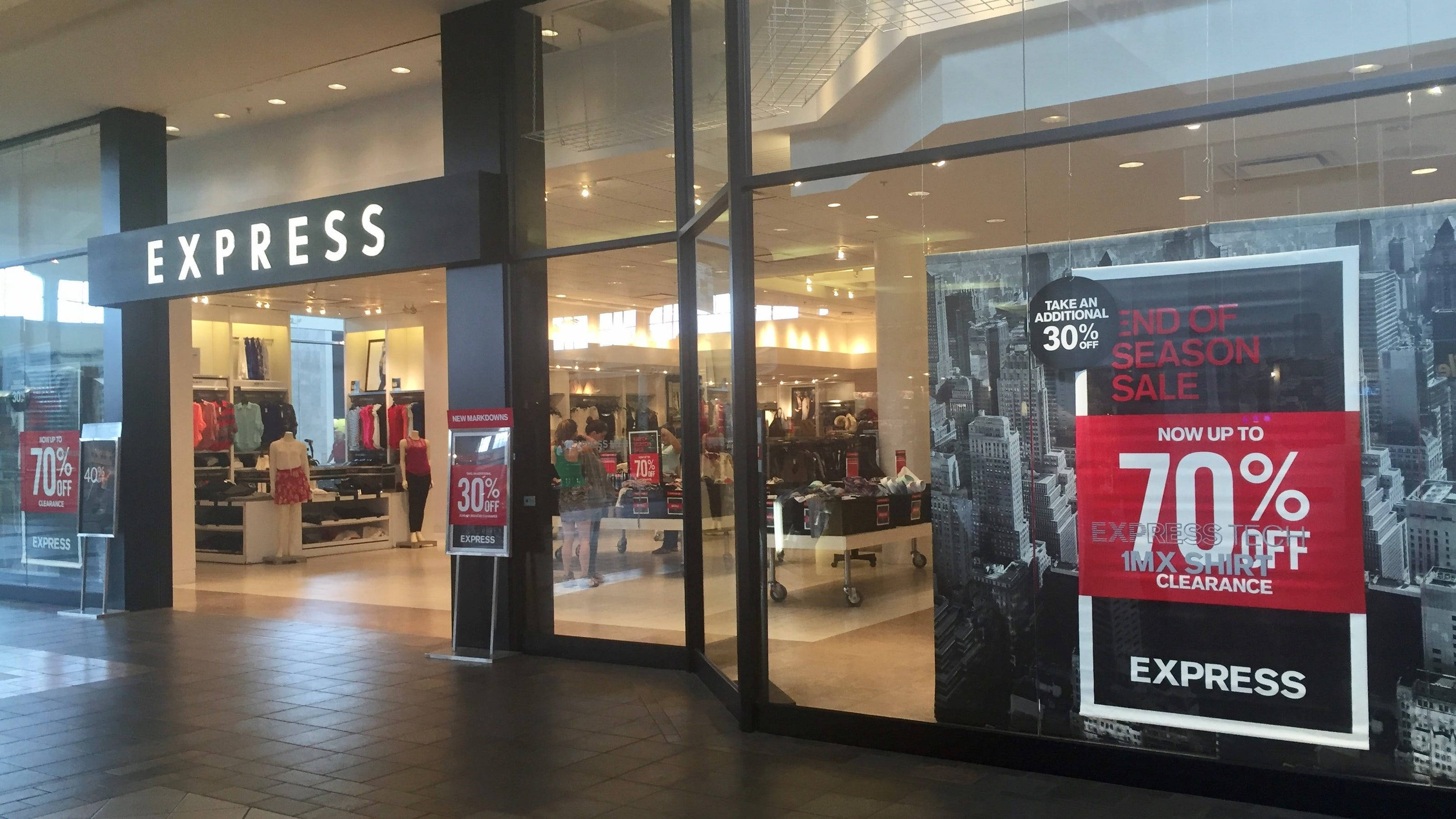 Express clothing store, large glass windows, bold sale signs, 2K Desktop Wallpaper