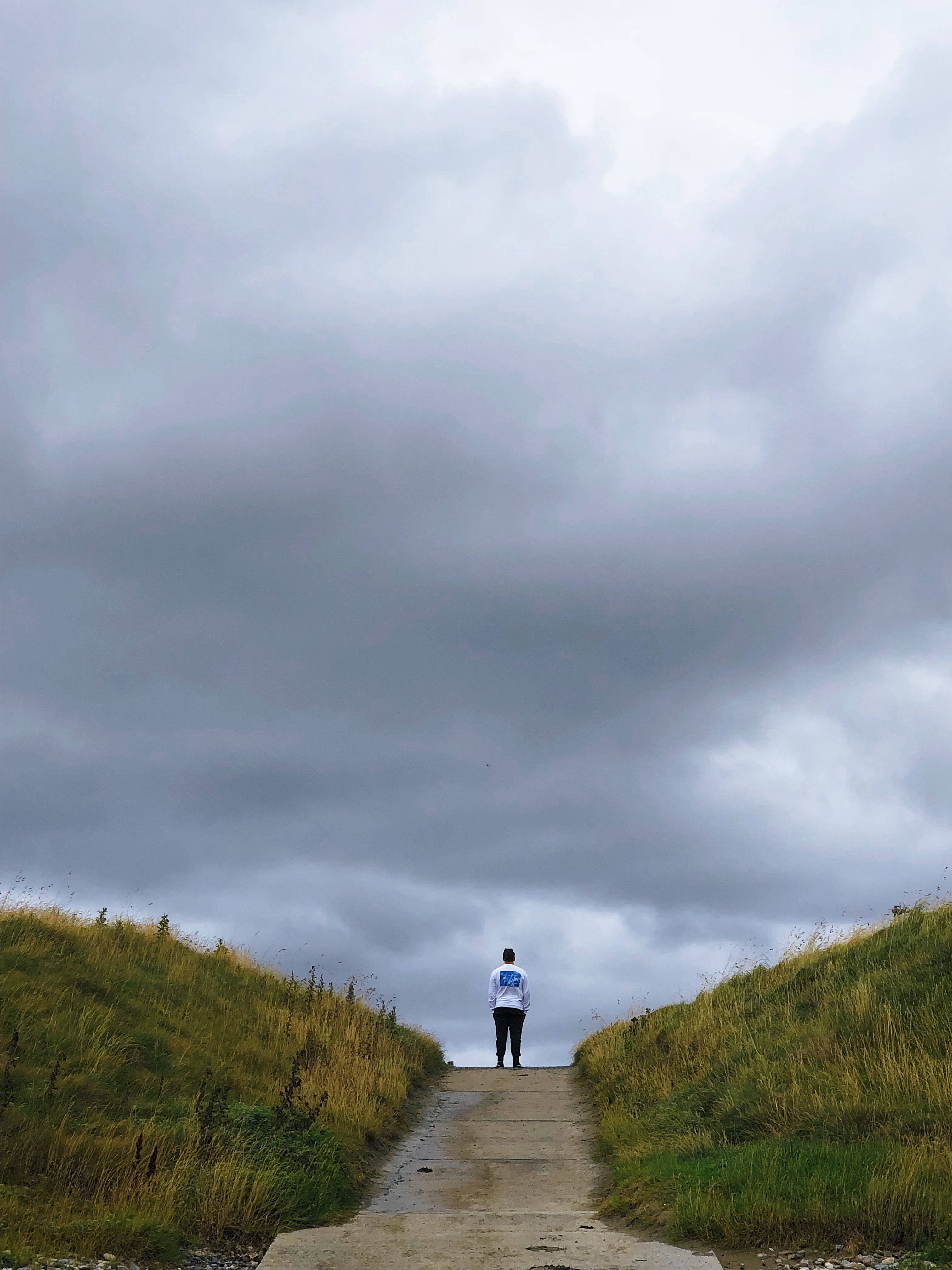 Storm Clouds, concrete path, grassy hills, 4K Phone Wallpaper