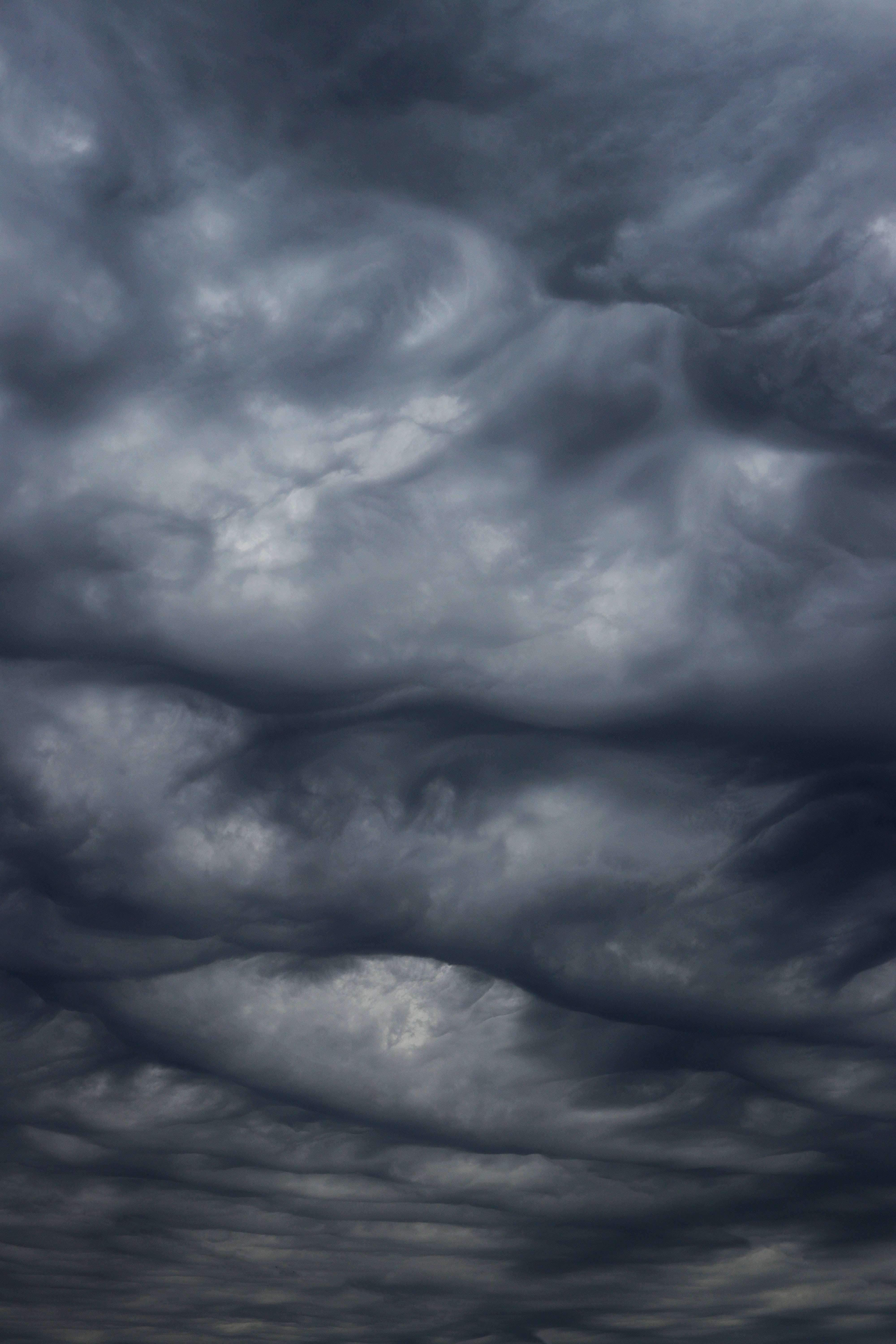 overcast storm sky, dense dark gray clouds, dramatic layers, 5K Phone Wallpaper