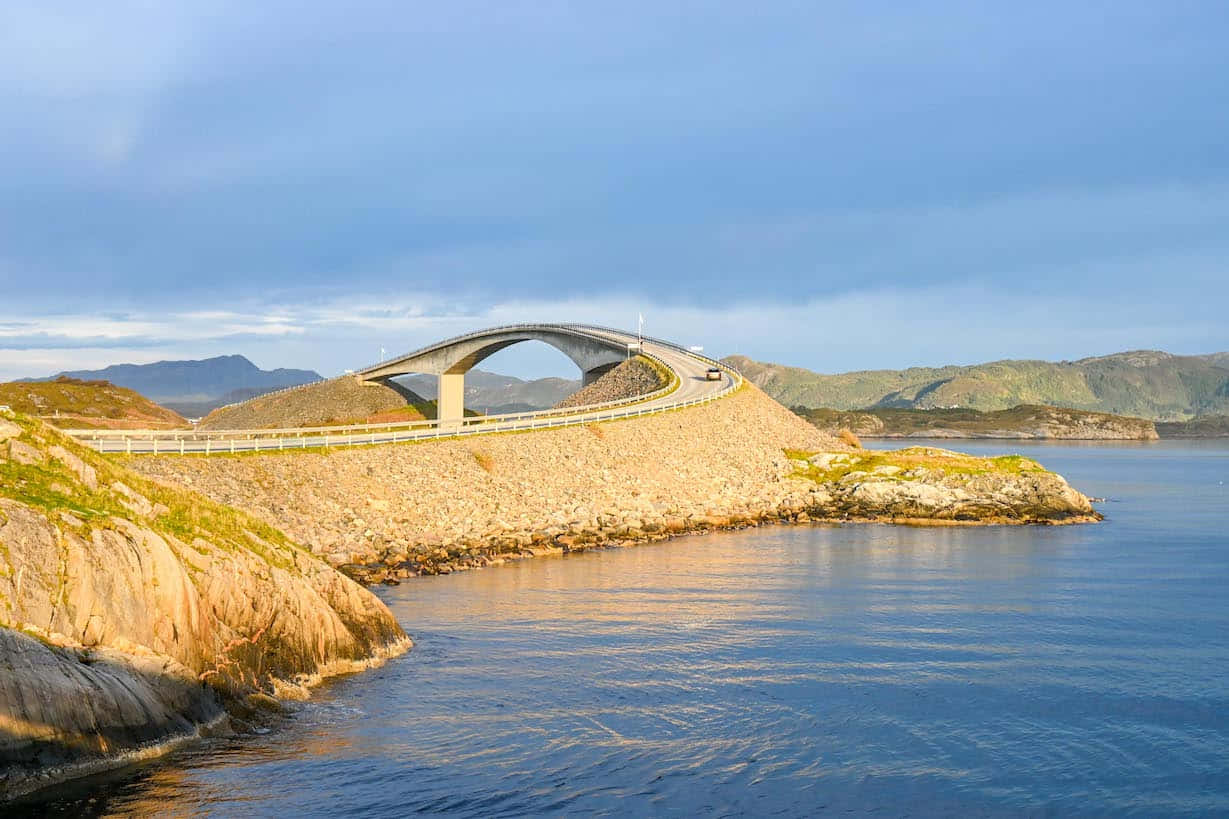 Storseisundet Bridge, rocky coastline, calm blue waters, SD Desktop Wallpaper