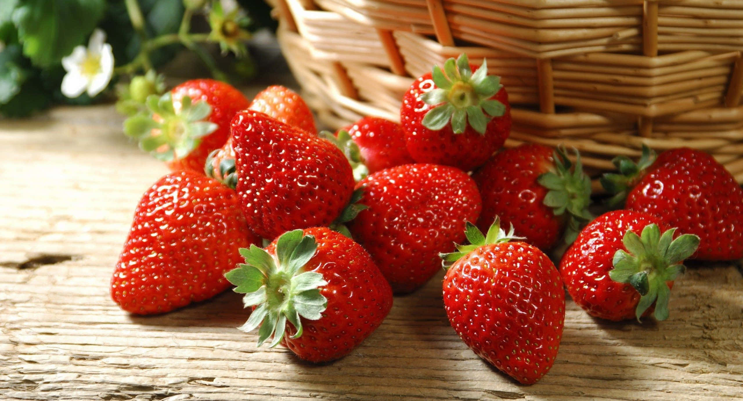 red strawberry, woven basket, rustic wooden surface, 2K Desktop Wallpaper