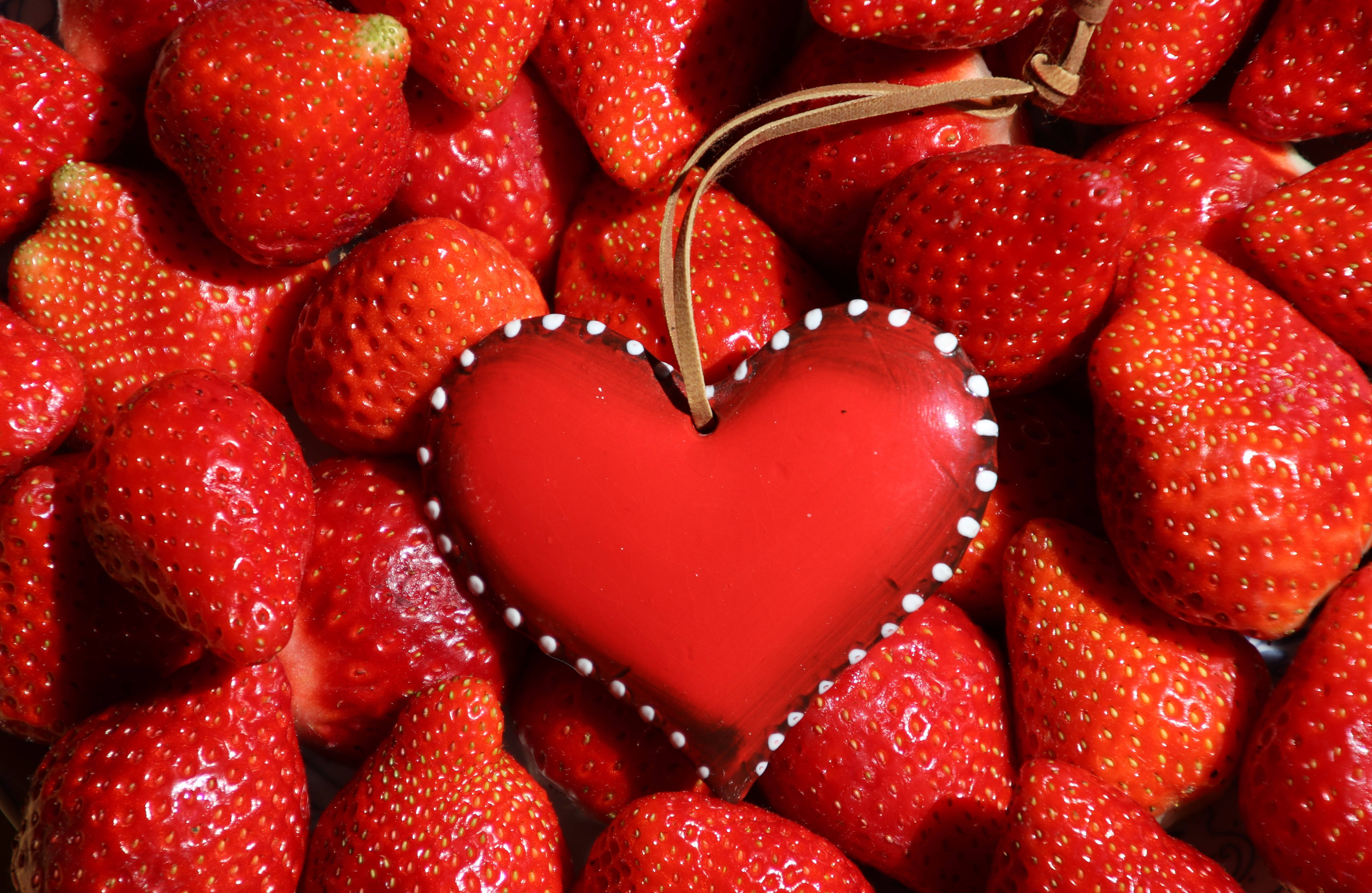 red heart ornament, white dots, vibrant pile of fresh strawberries, 5K Desktop Wallpaper