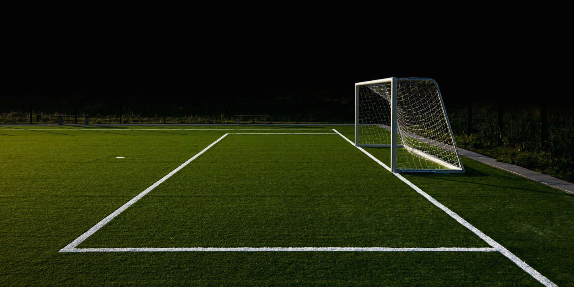 nighttime soccer field, goal post, vibrant green field, Full HD Desktop Wallpaper