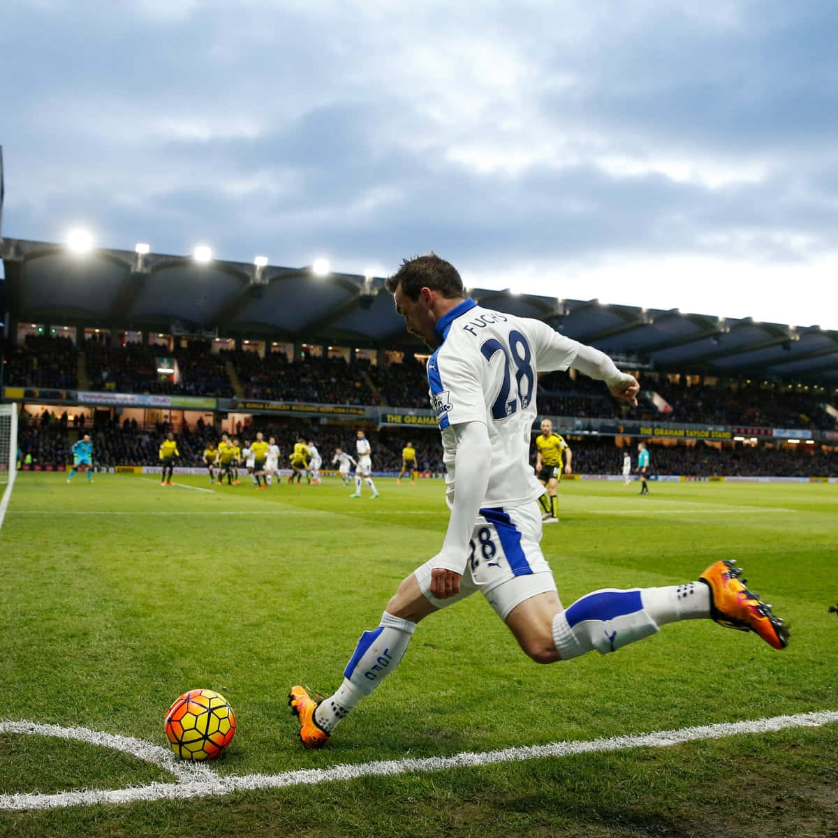 soccer player, white and blue kit, vibrant orange and yellow ball, SD Desktop Wallpaper