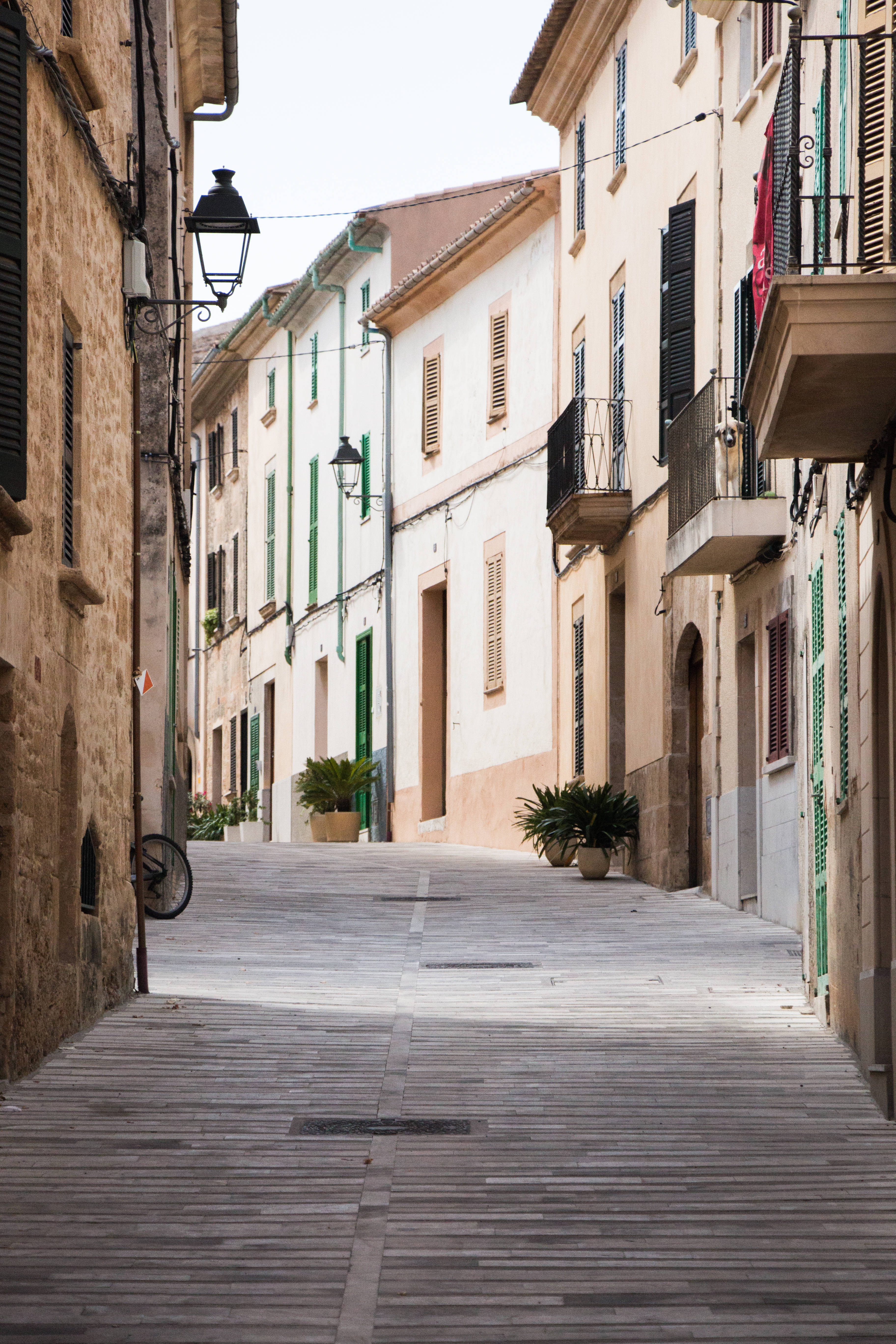 pastel-colored buildings, green shutters, European town, 5K Phone Wallpaper