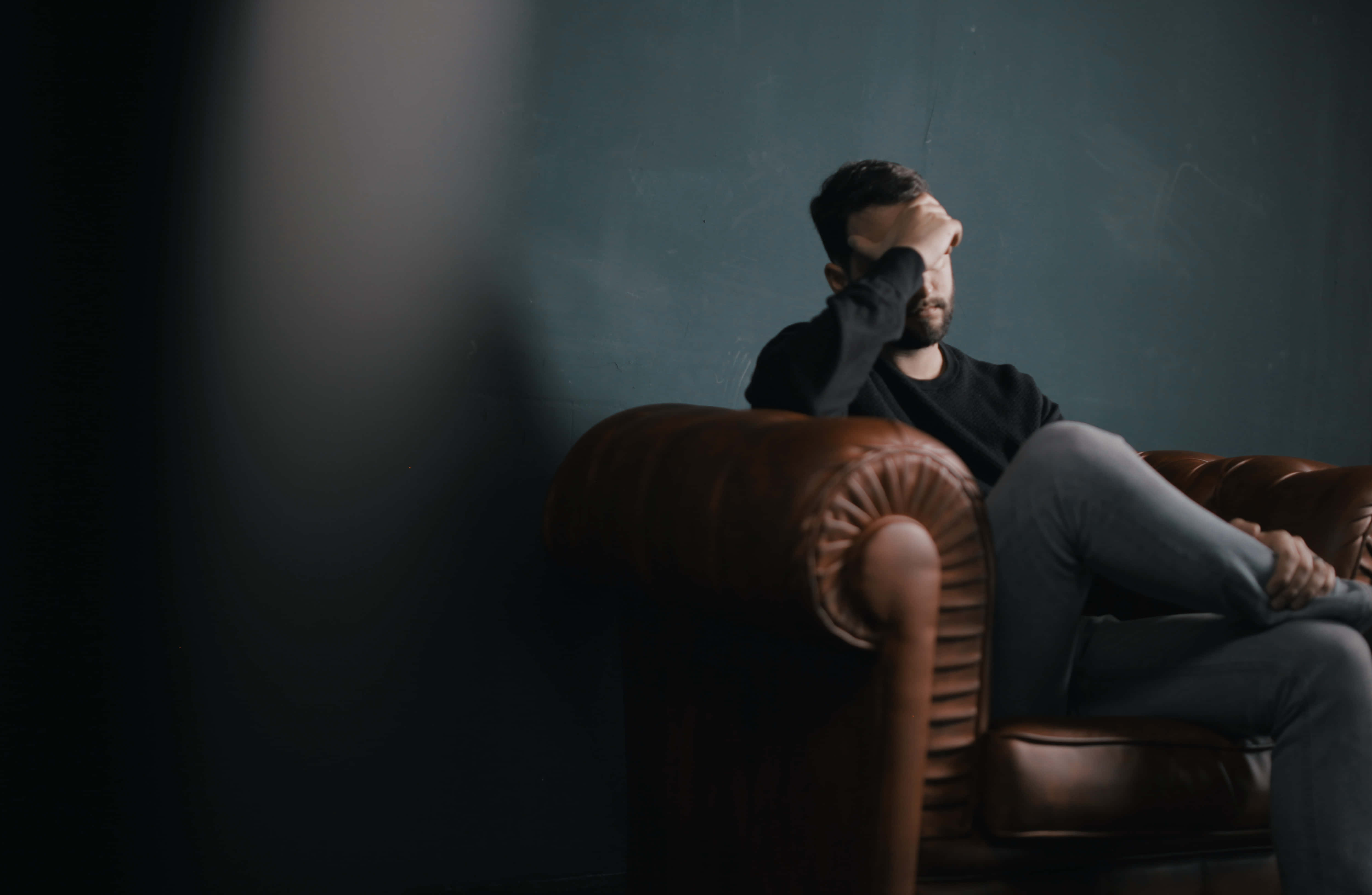 Stress Man, leather armchair, dimly lit room, 4K Desktop Wallpaper