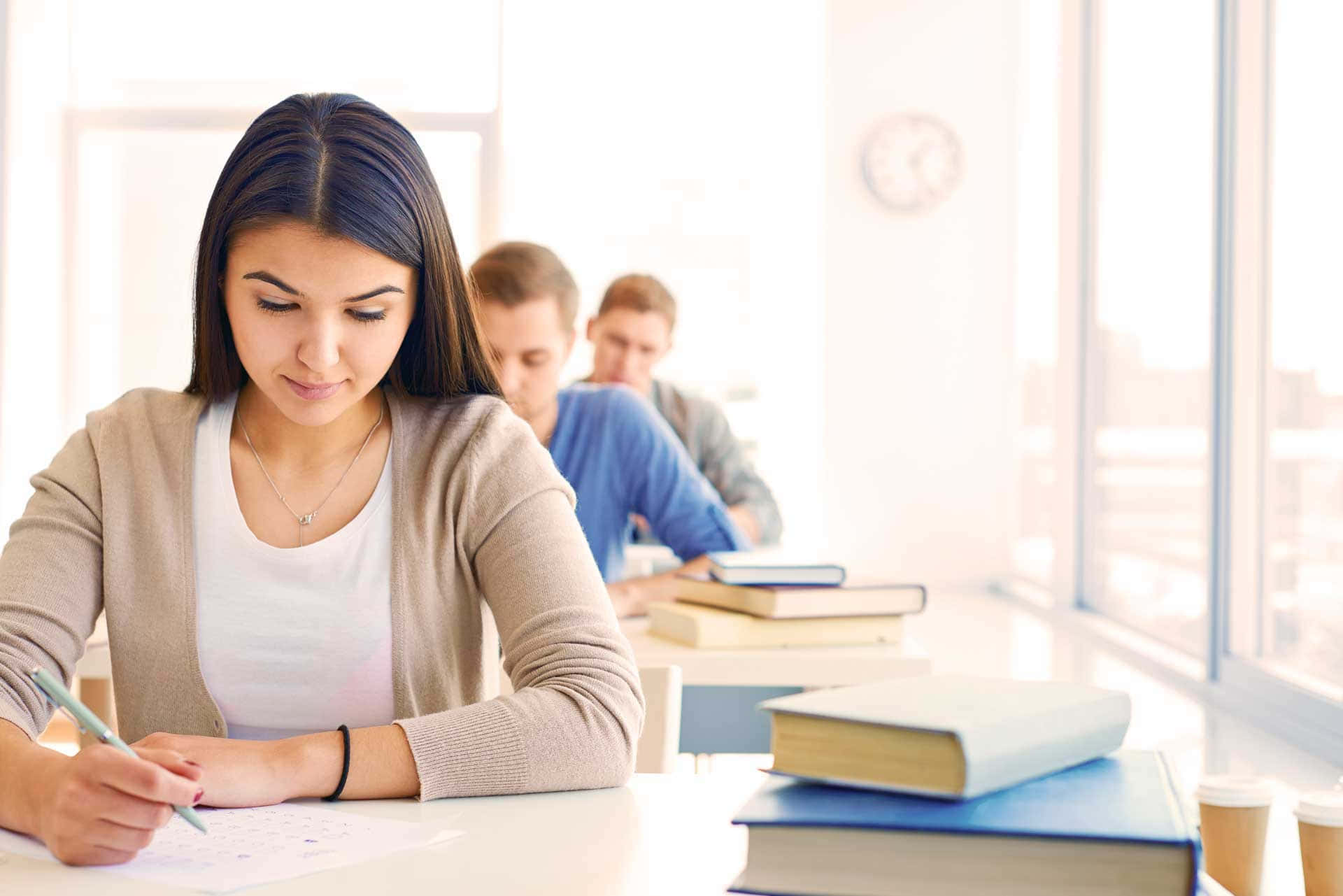 focused young woman, desk, bright classroom, Full HD Desktop Wallpaper