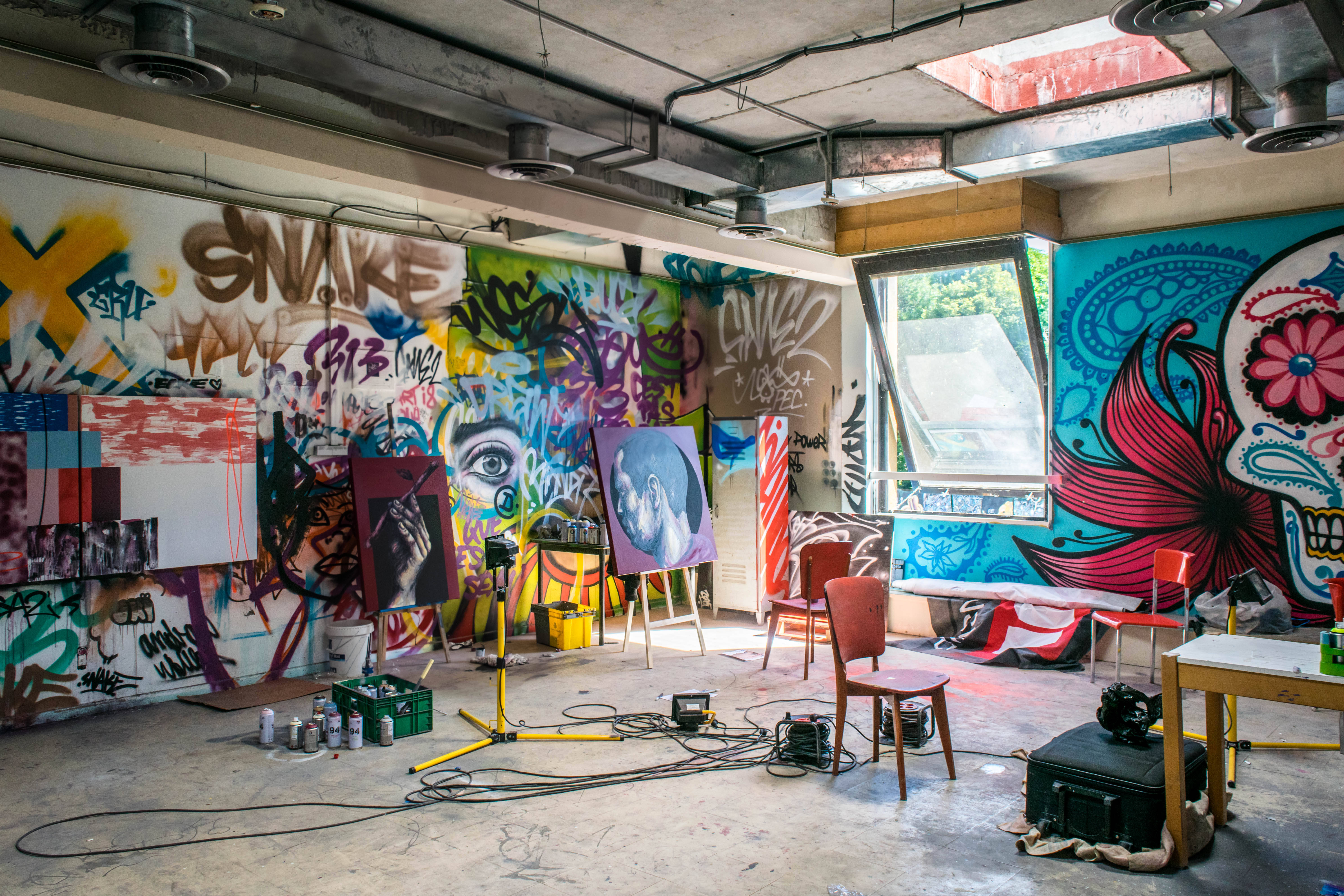 street art studio, gritty urban art studio, vibrant graffiti murals, 5K Desktop Wallpaper
