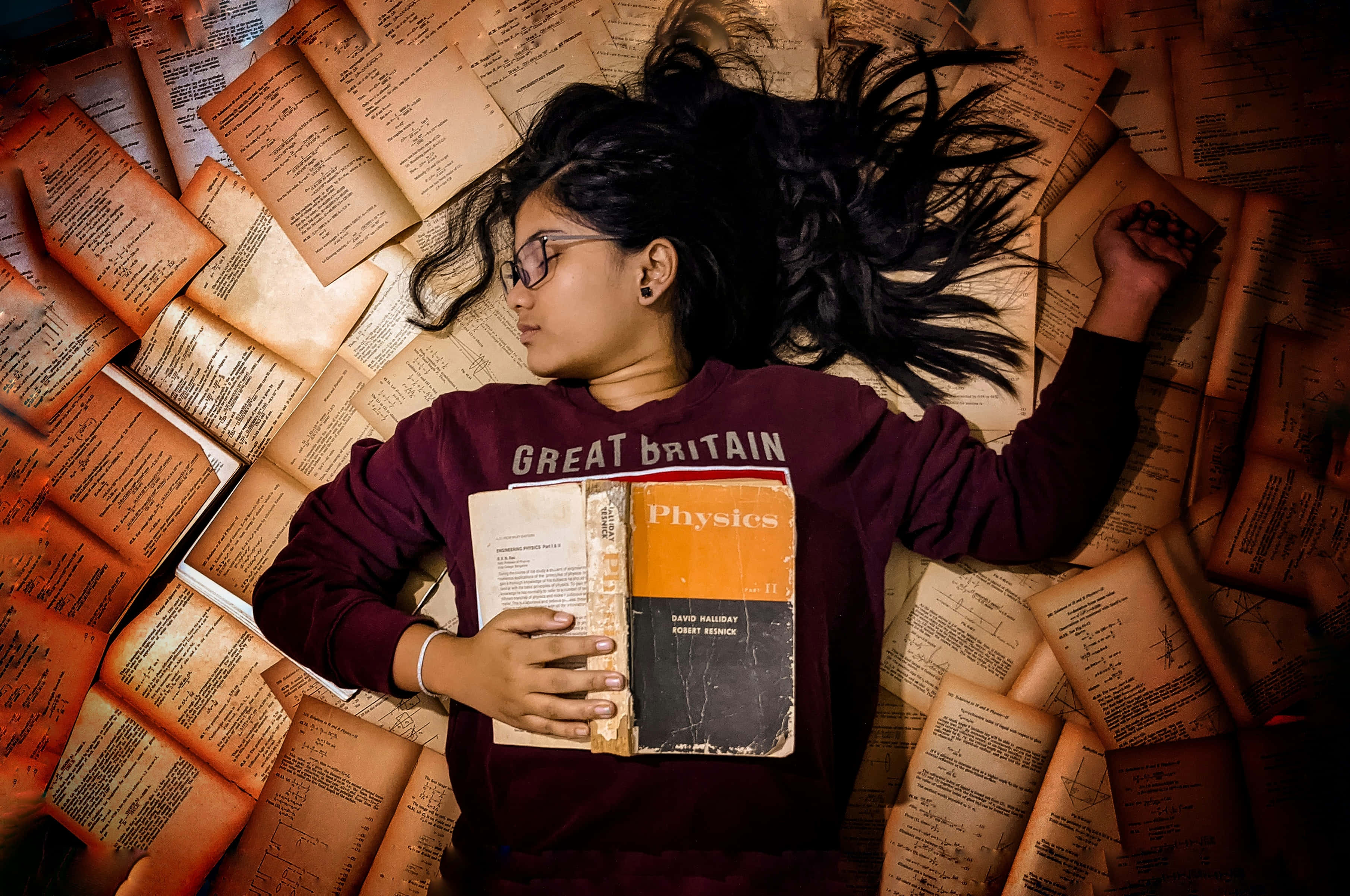 young woman, glasses, physics textbooks, 2K Desktop Wallpaper